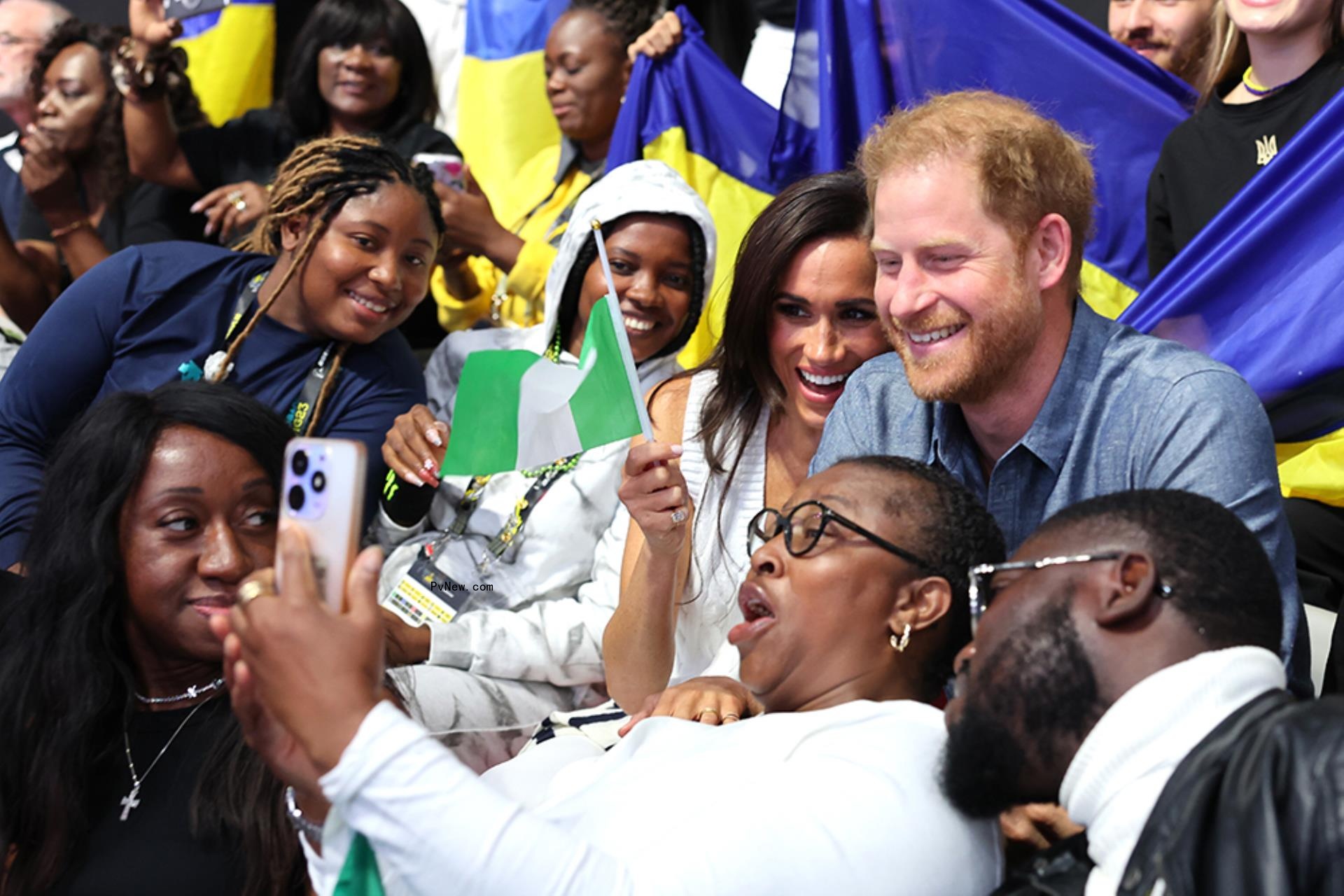 Meghan Markle and Prince Harry taking a selfie 