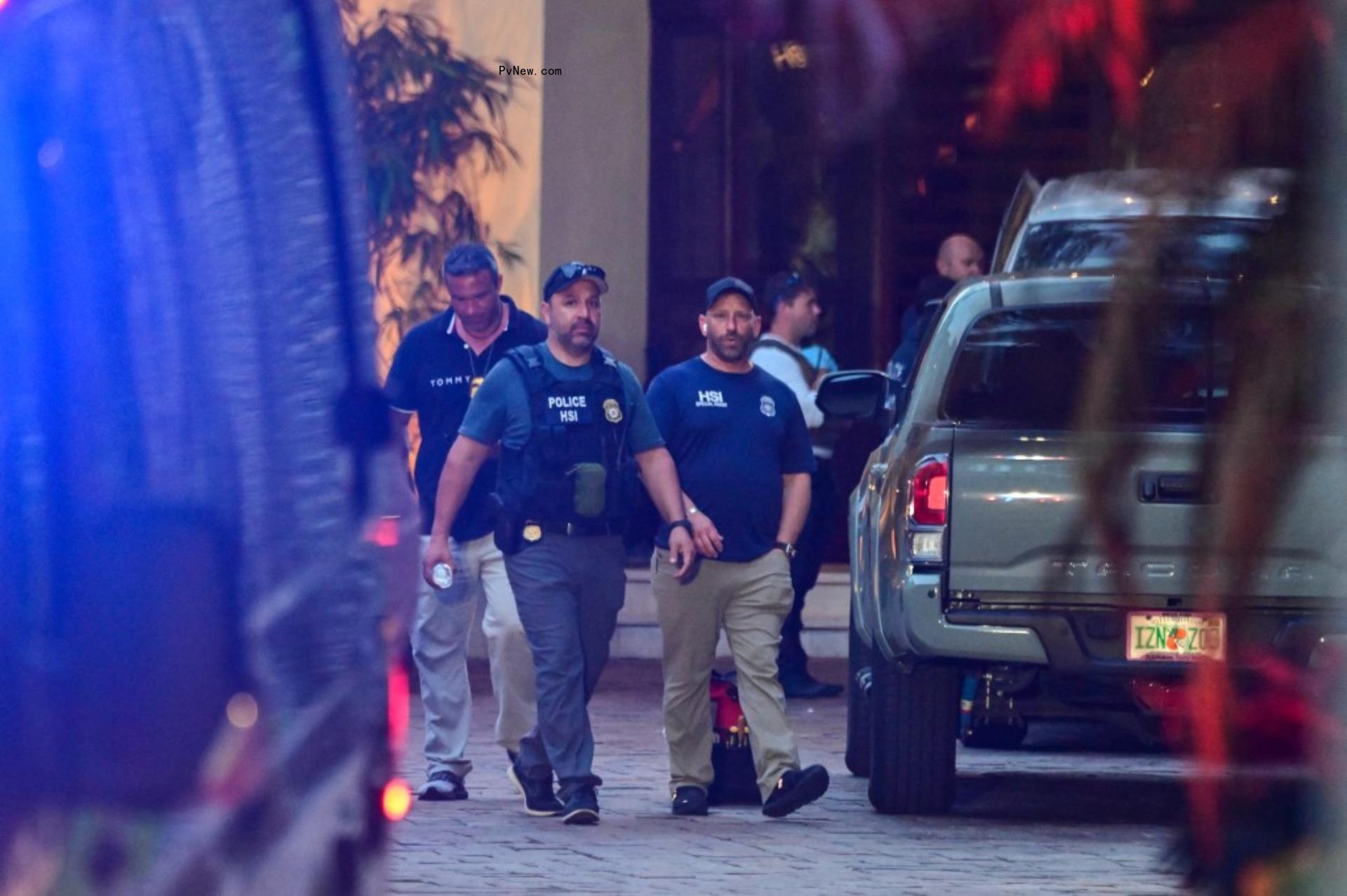 Homeland Security agents amid the raid on Diddy's homes.