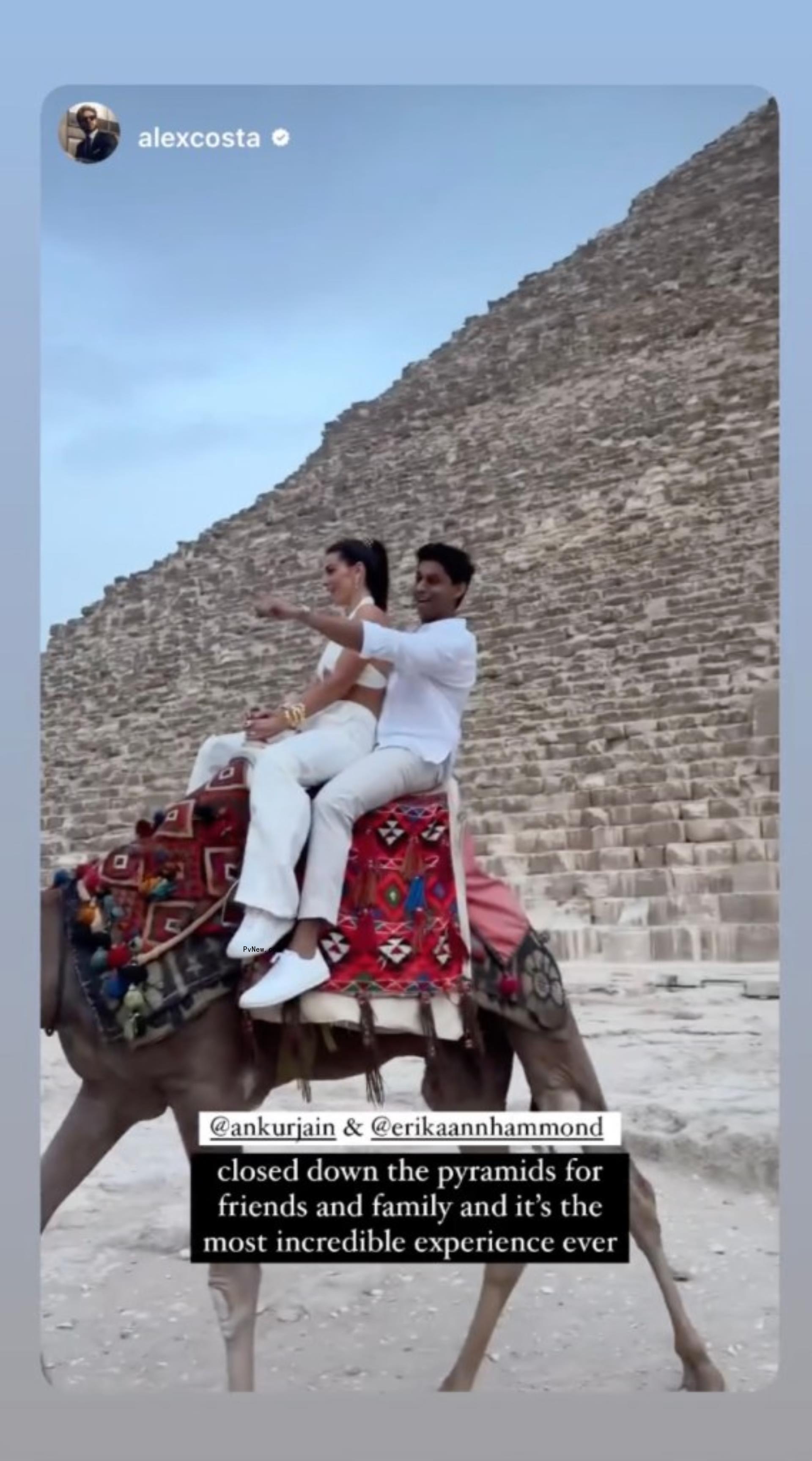 Ankur Jain and Erika Hammond riding a camel.