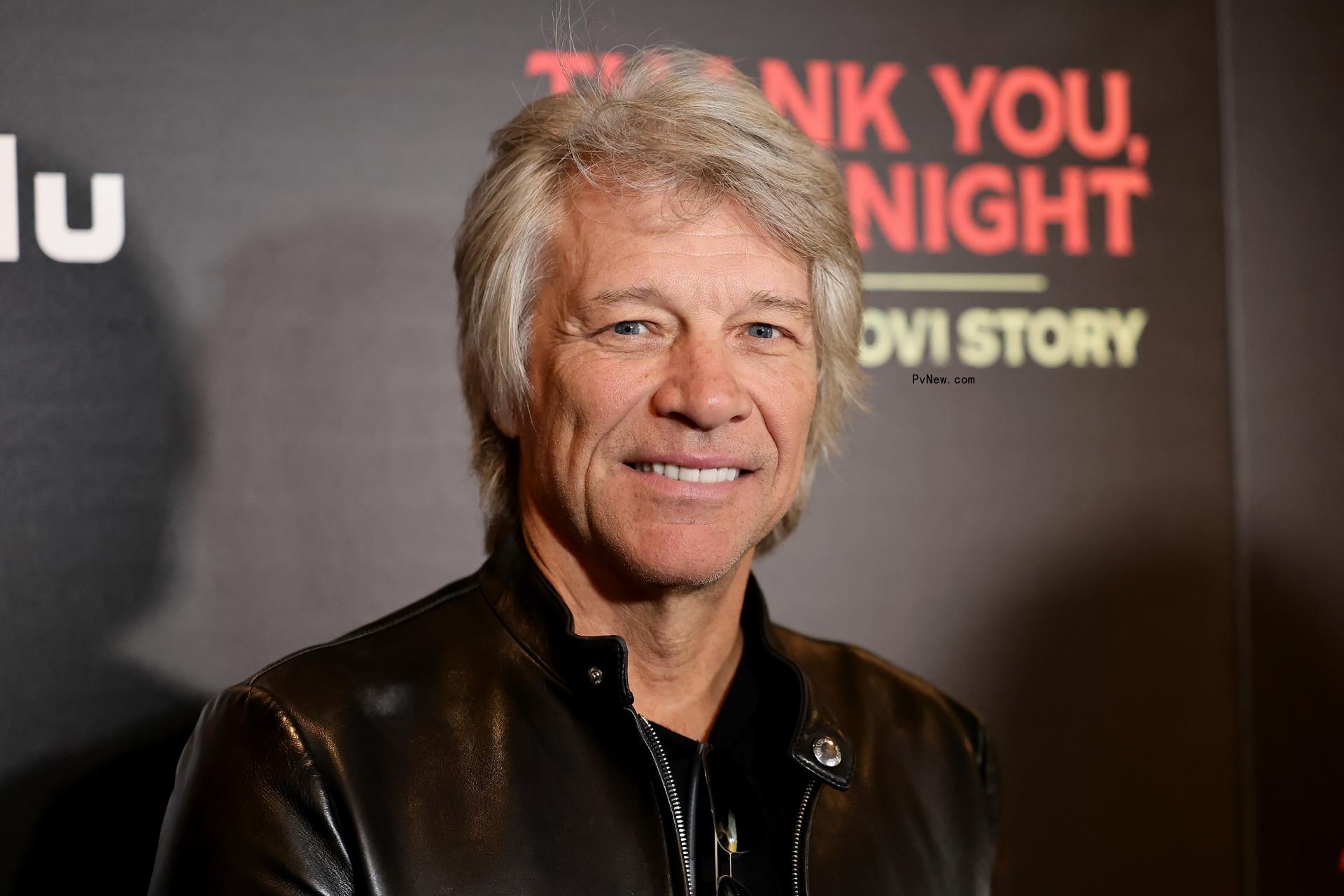 Jon Bon Jovi posing on a red carpet