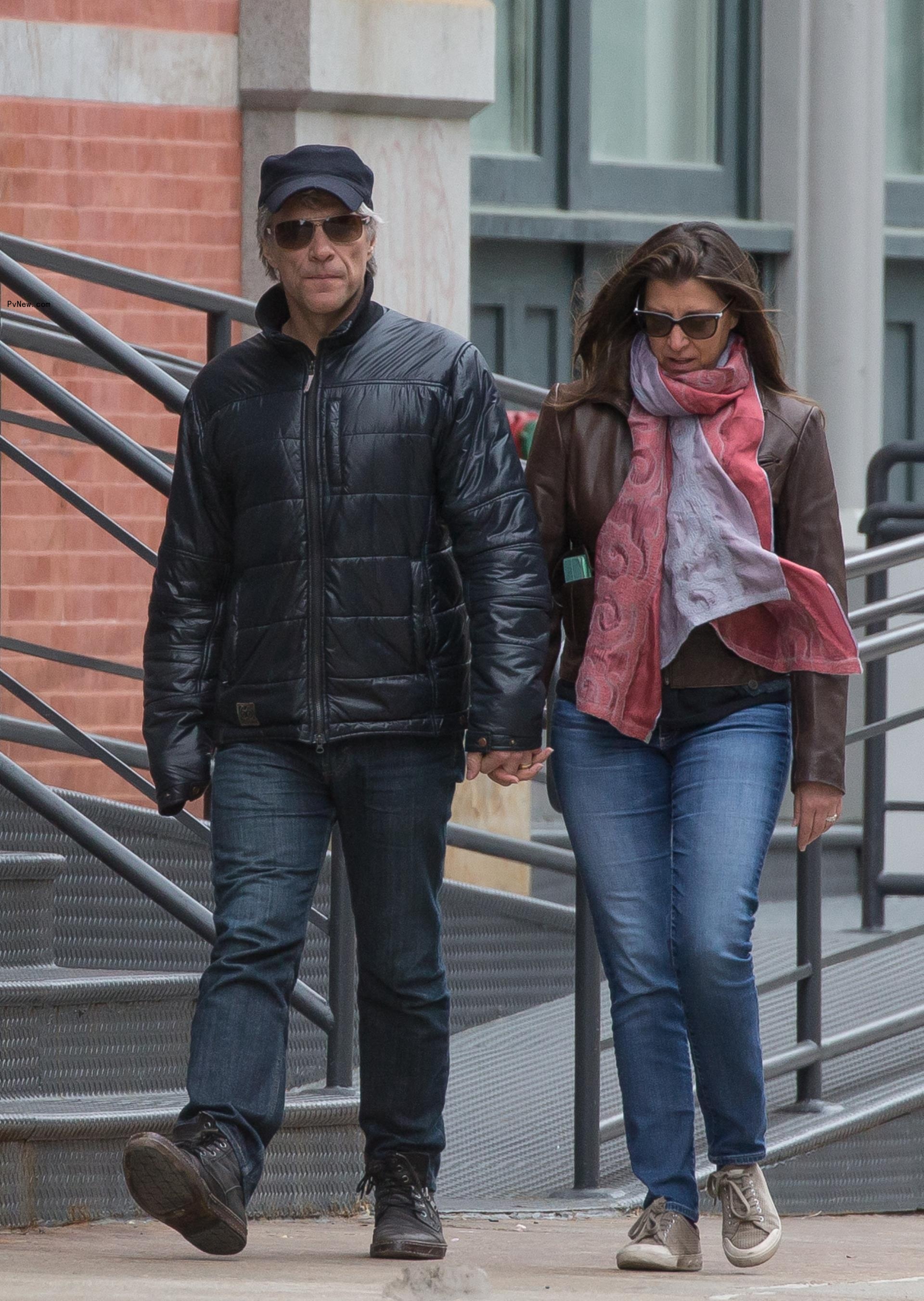 Jon Bon Jovi and Dorothea Hurley walking 