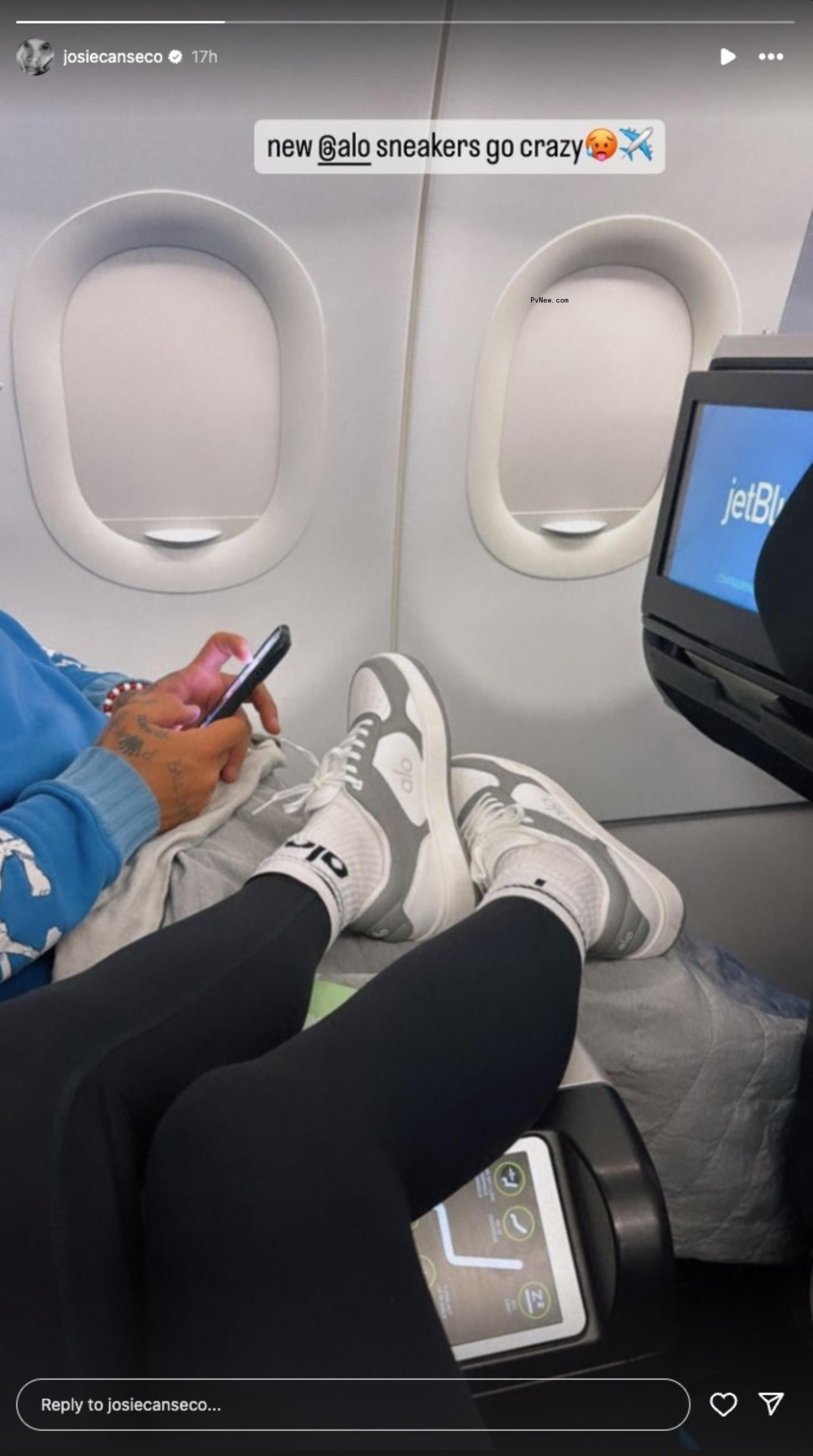 a woman's legs resting on a man's legs