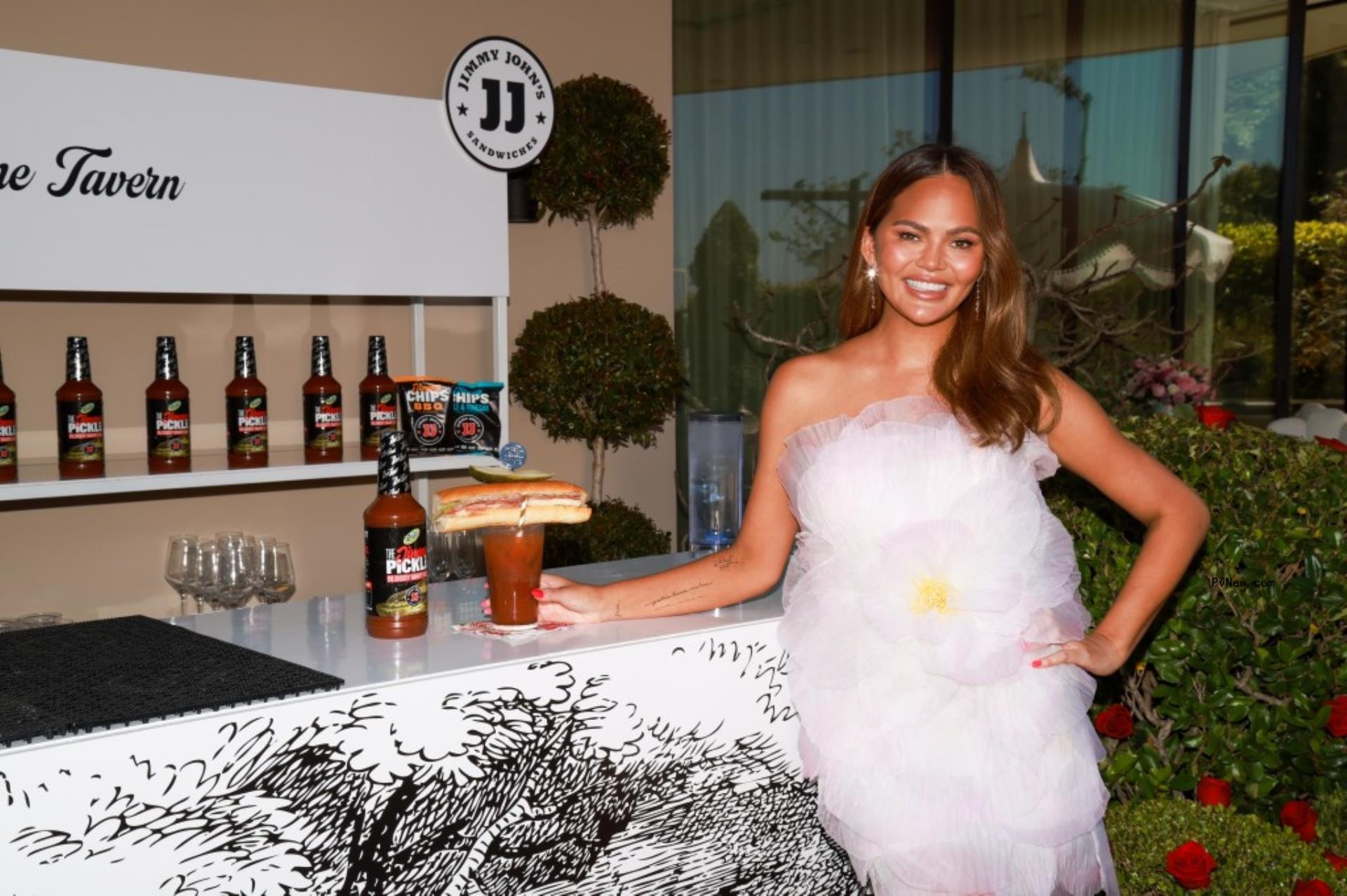 Chrissy Teigen with a bloody mary. 