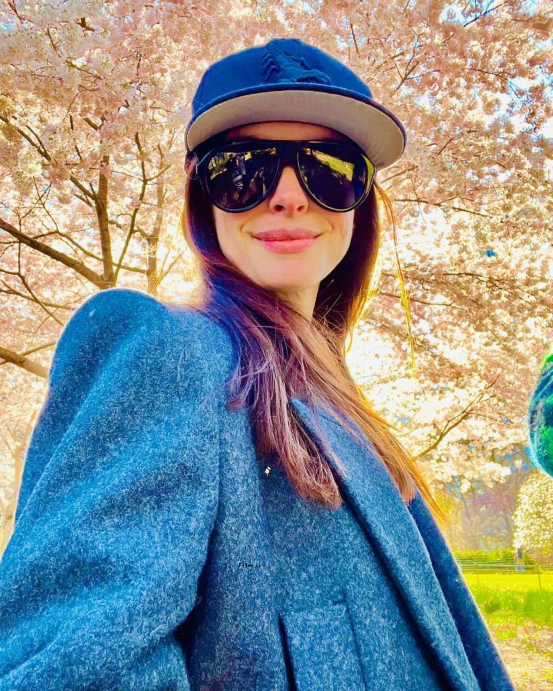 Anne Hathaway at a park. 