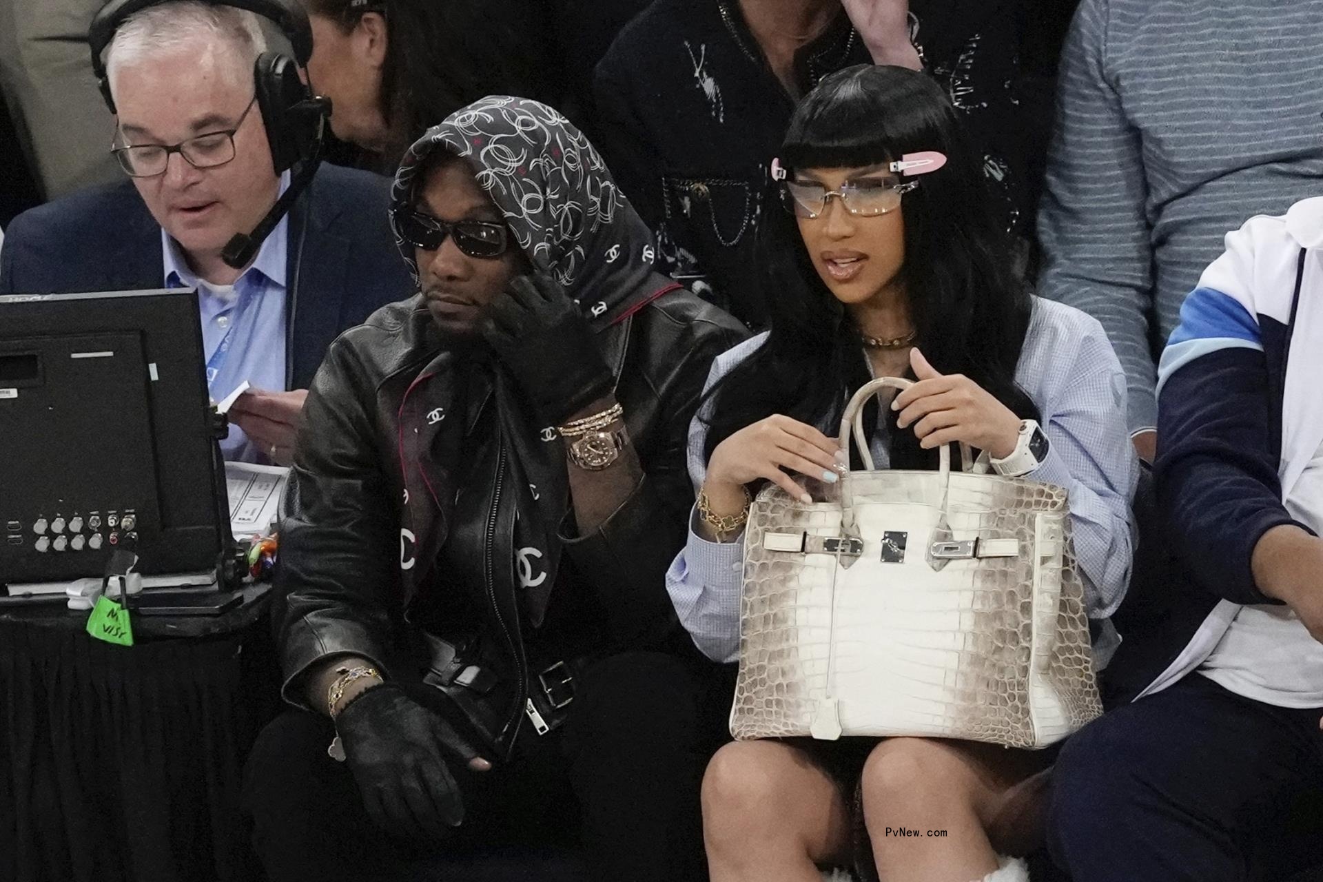 offset and cardi b sitting court-side