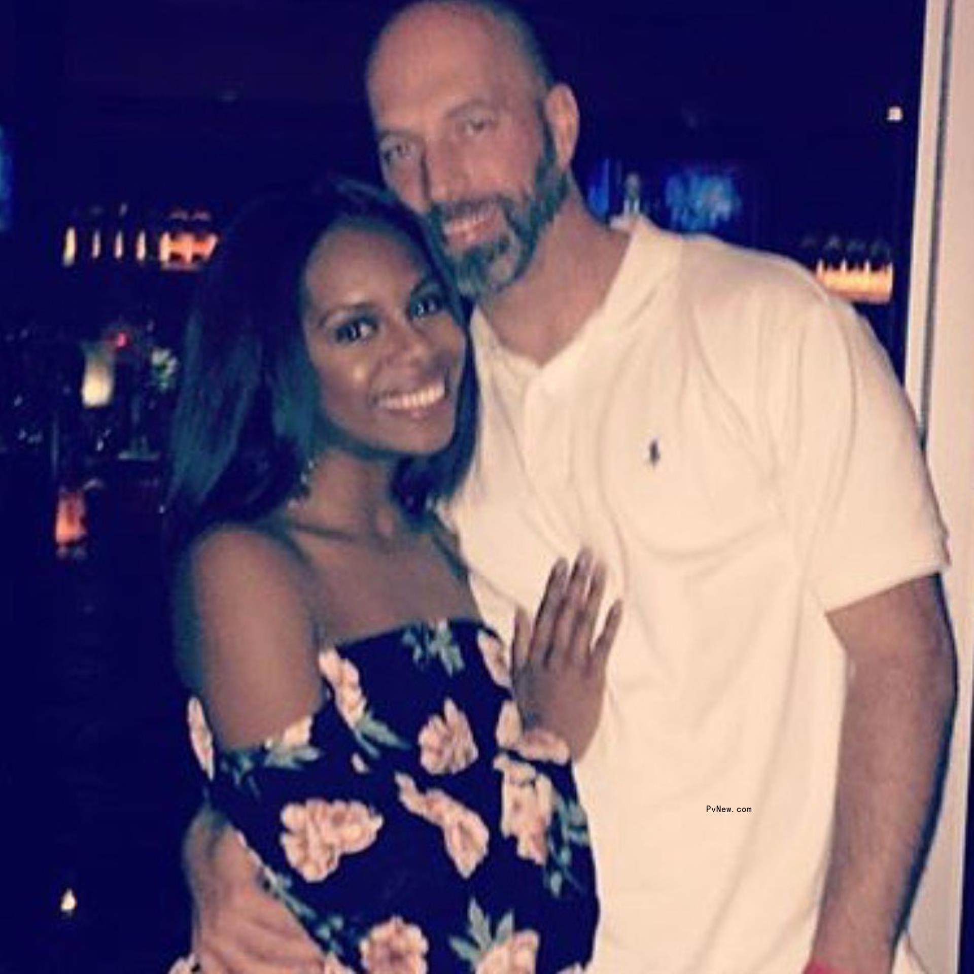 Candiace Dillard-Bassett and Chris Bassett posing together 