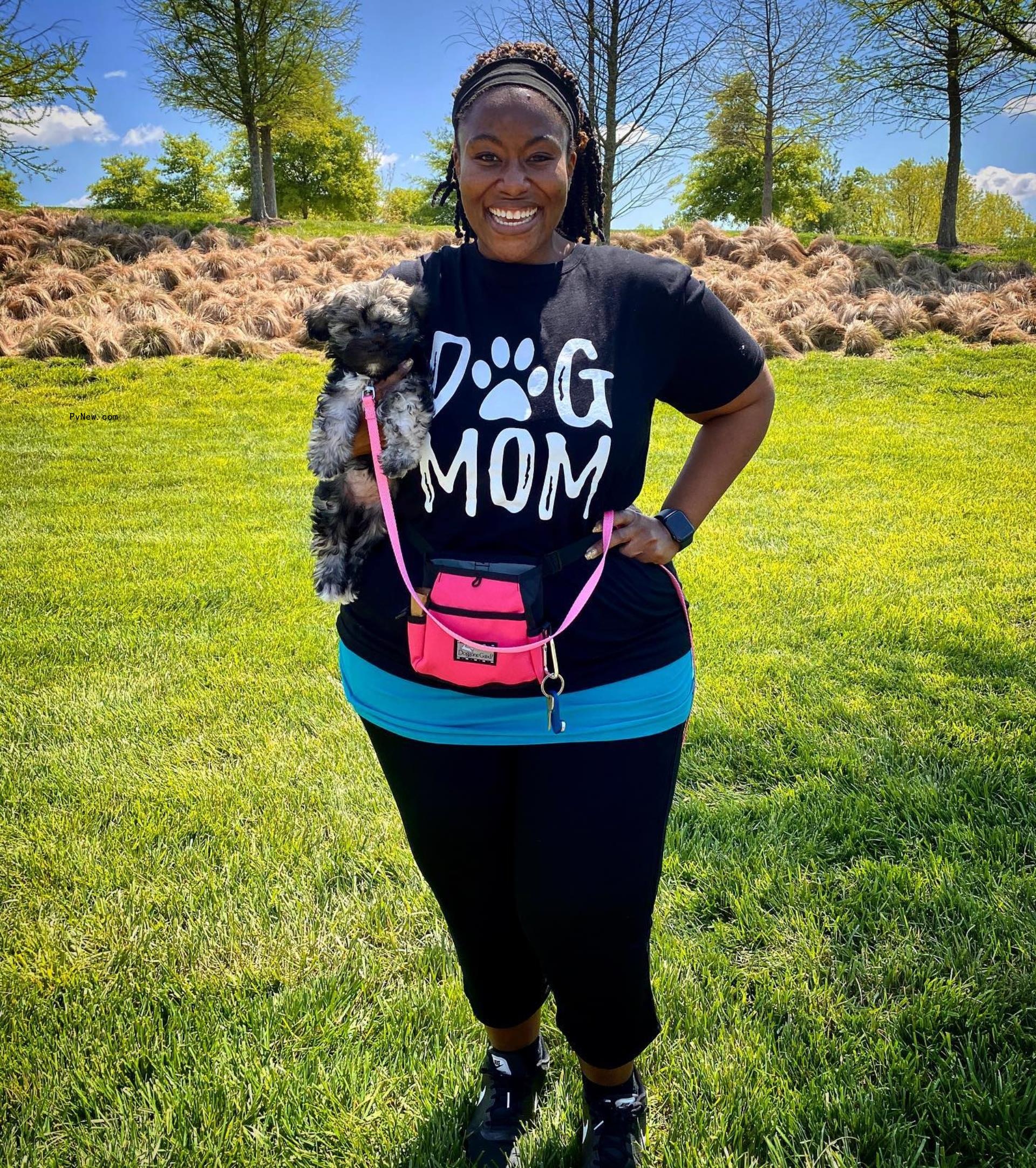 Mandisa Hundley holding her dog.