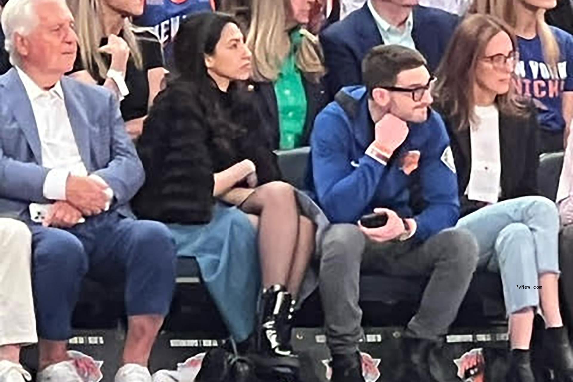 Huma Abedin and Alex Soros sit next to each other at the Knicks playoff game at Madison Square Garden.
