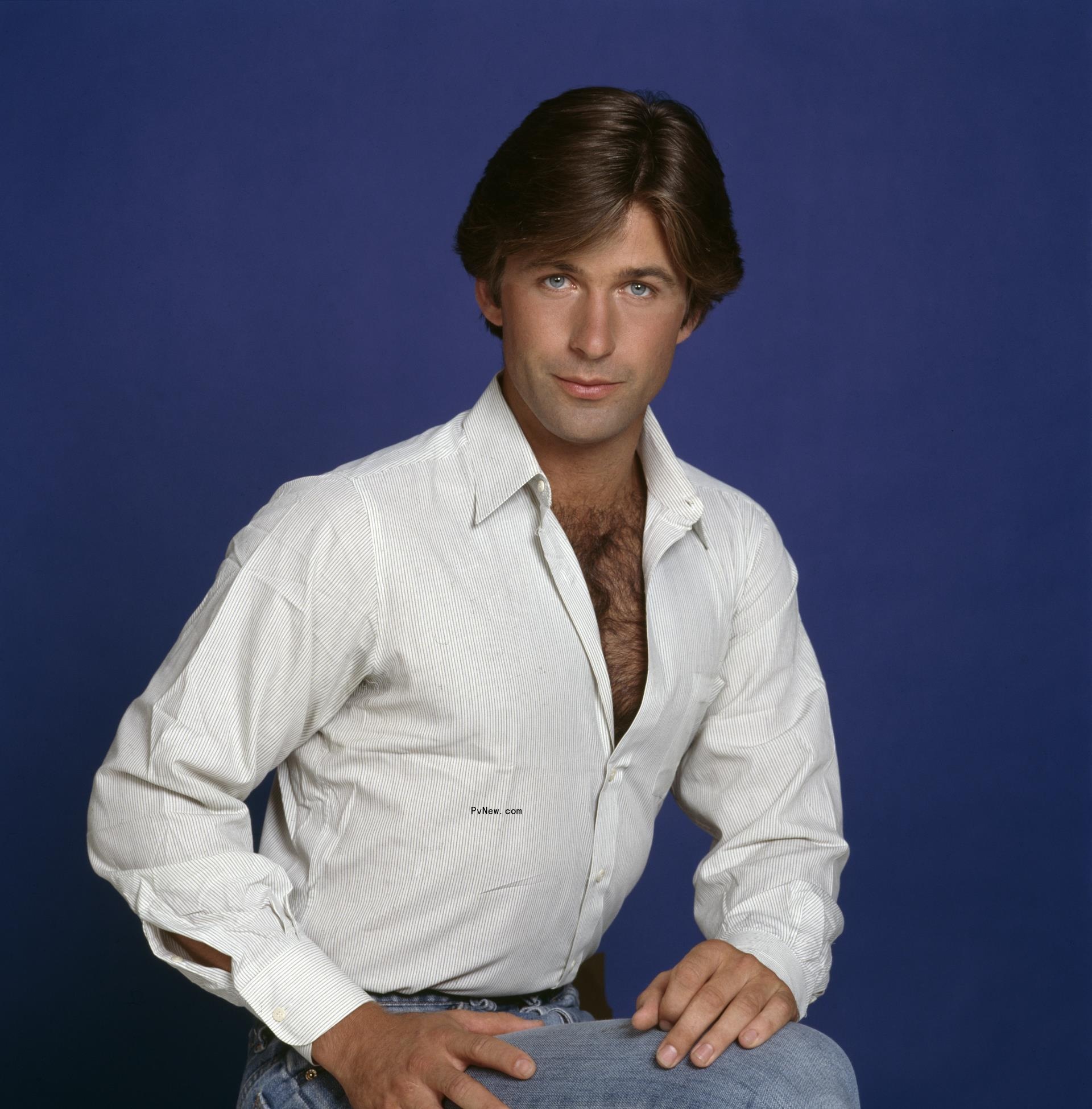A young Alec Baldwin sitting for a photo