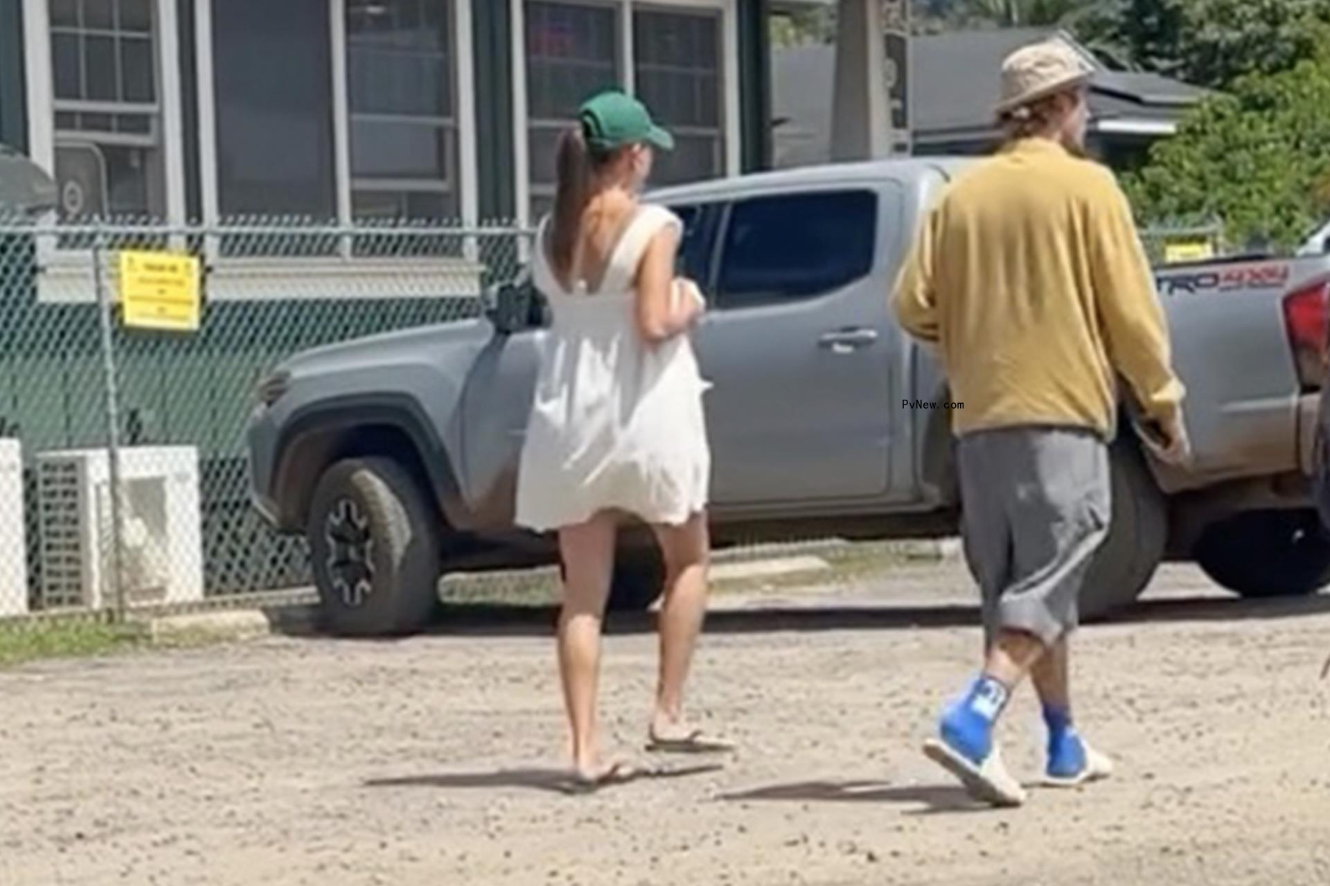 Justin and Hailey Bieber  take a walk in Hawaii.