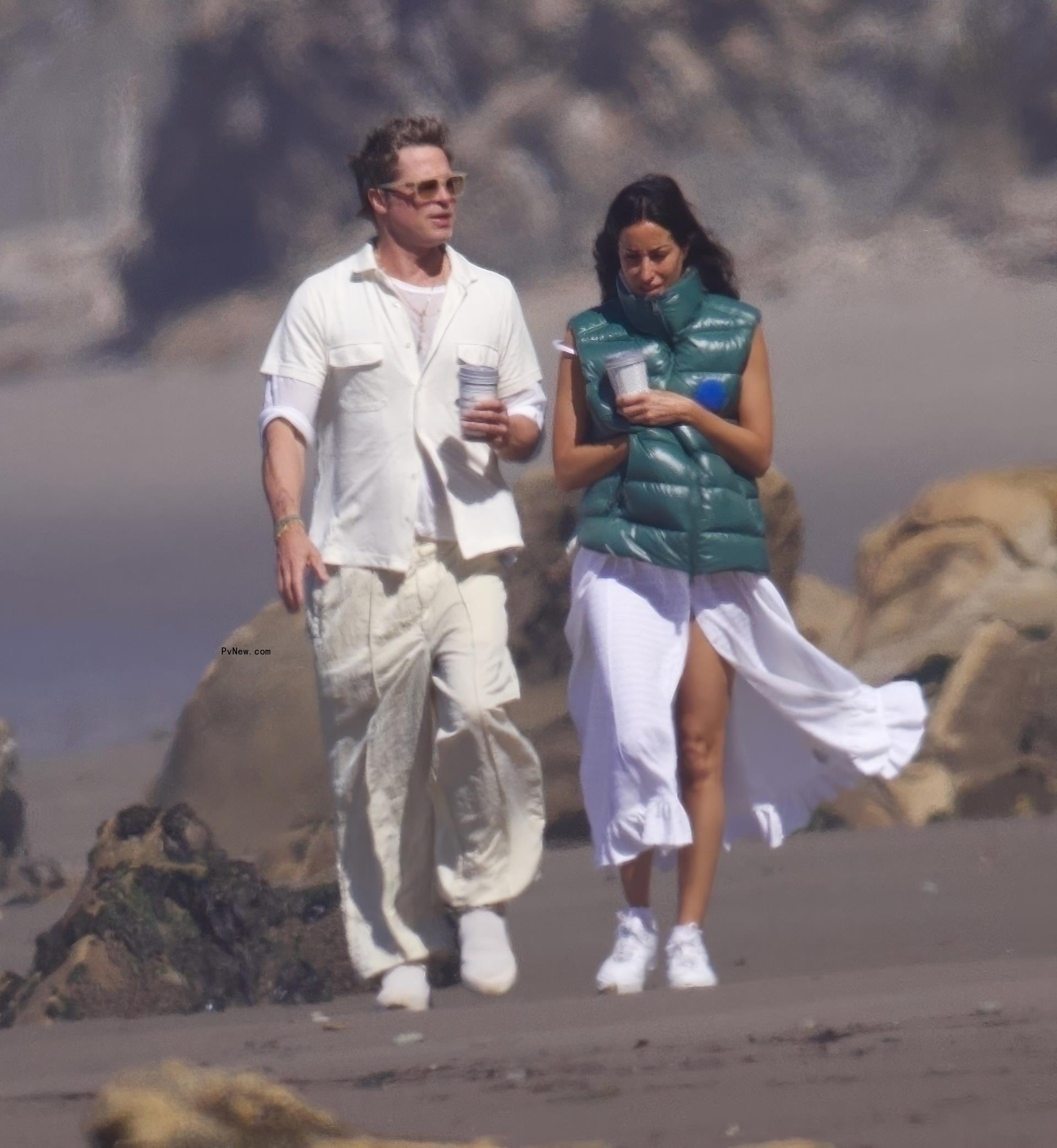 Brad Pitt and Ines de Ramon walking on the beach in Santa Barbara, Calif.