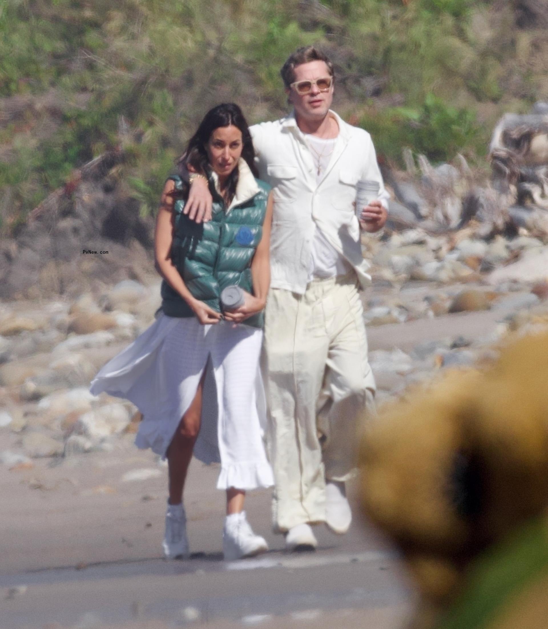 Brad Pitt and Ines de Ramon walking on the beach in Santa Barbara, Calif.