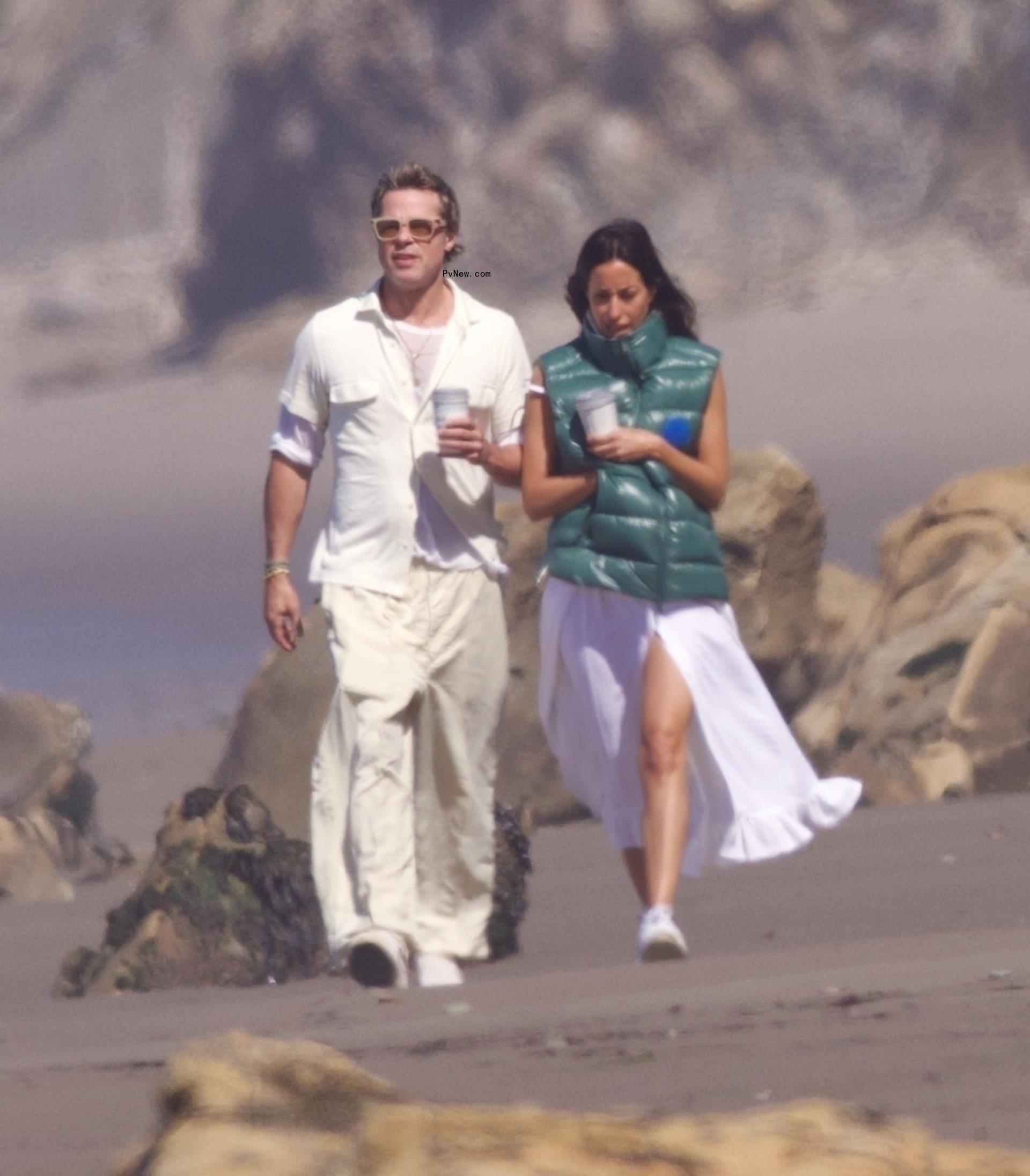 Brad Pitt and Ines de Ramon walking on the beach in Santa Barbara, Calif.