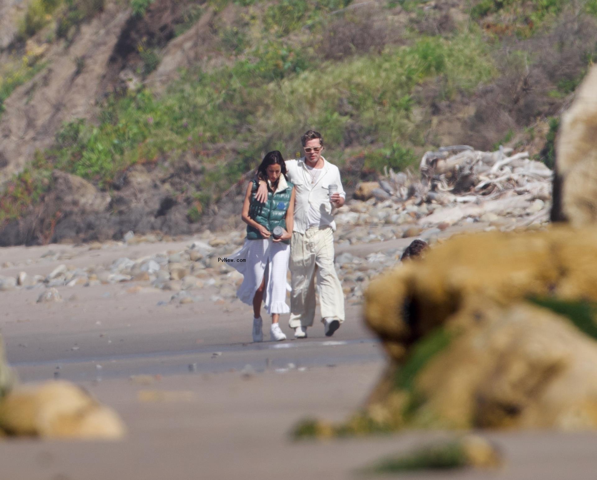 Brad Pitt and Ines de Ramon walking on the beach in Santa Barbara, Calif.