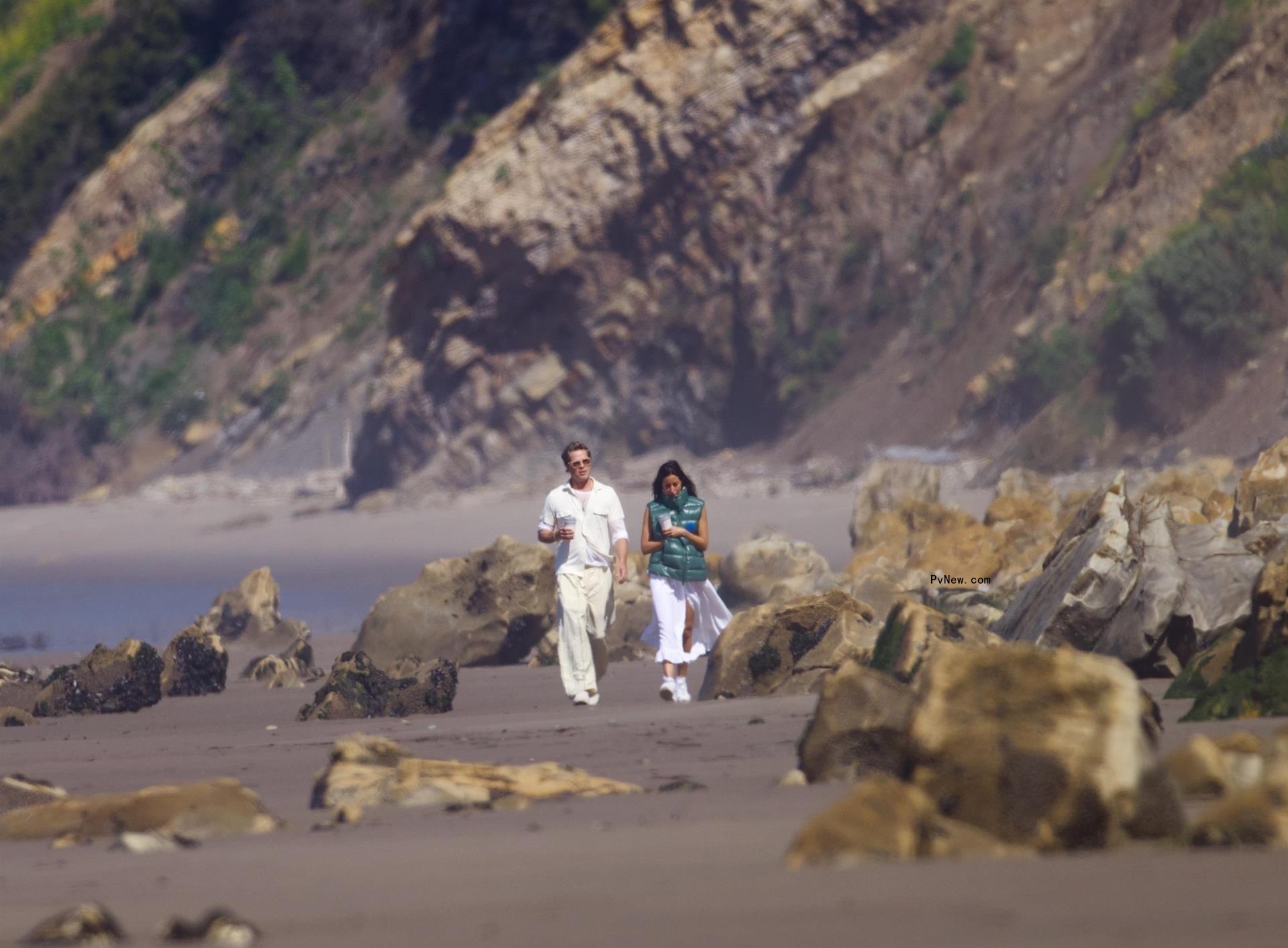 Brad Pitt and Ines de Ramon walking on the beach in Santa Barbara, Calif.