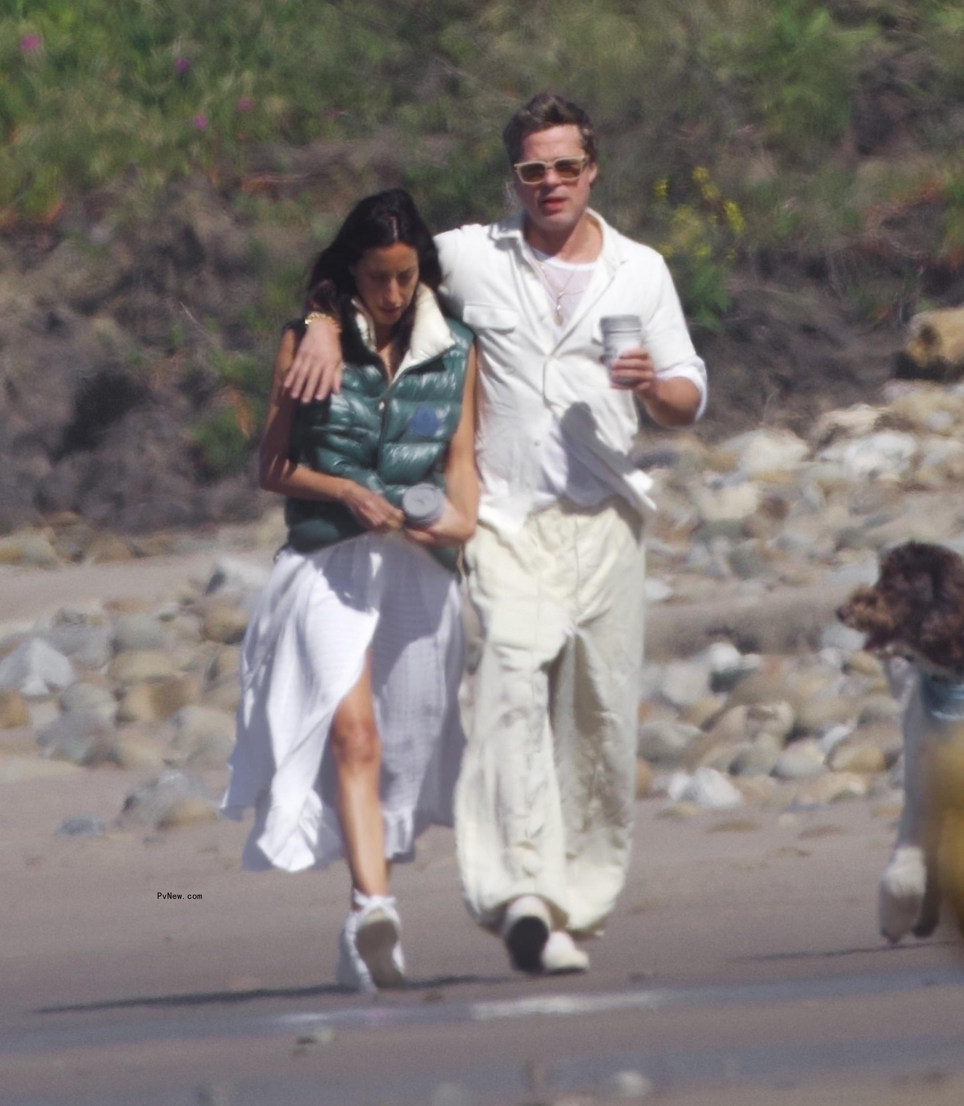 Brad Pitt and Ines de Ramon walking on the beach in Santa Barbara, Calif.