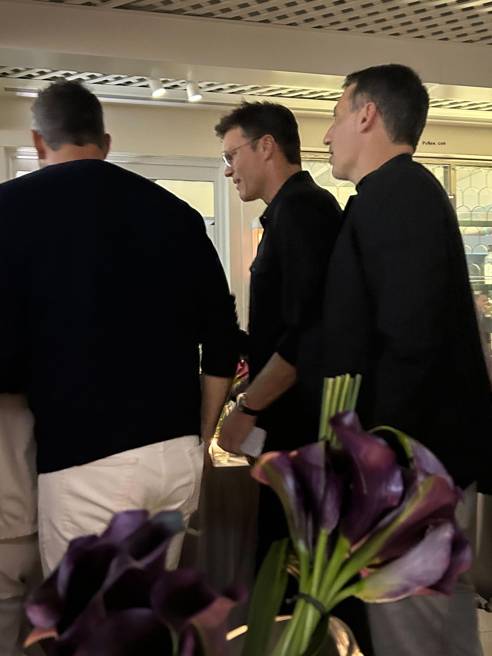 Tom Brady leaving a party.