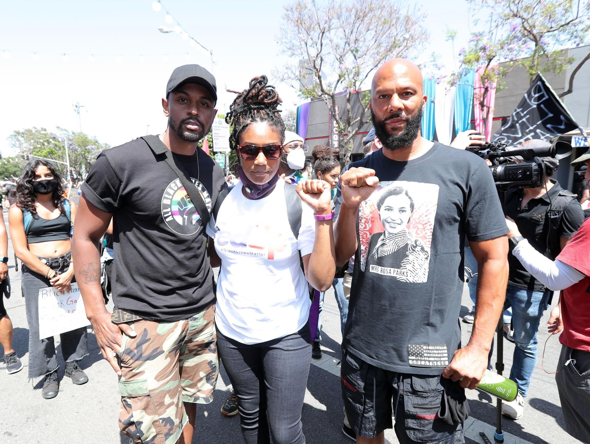 Brandon Anthony, Tiffany Haddish and Common posing for a photo
