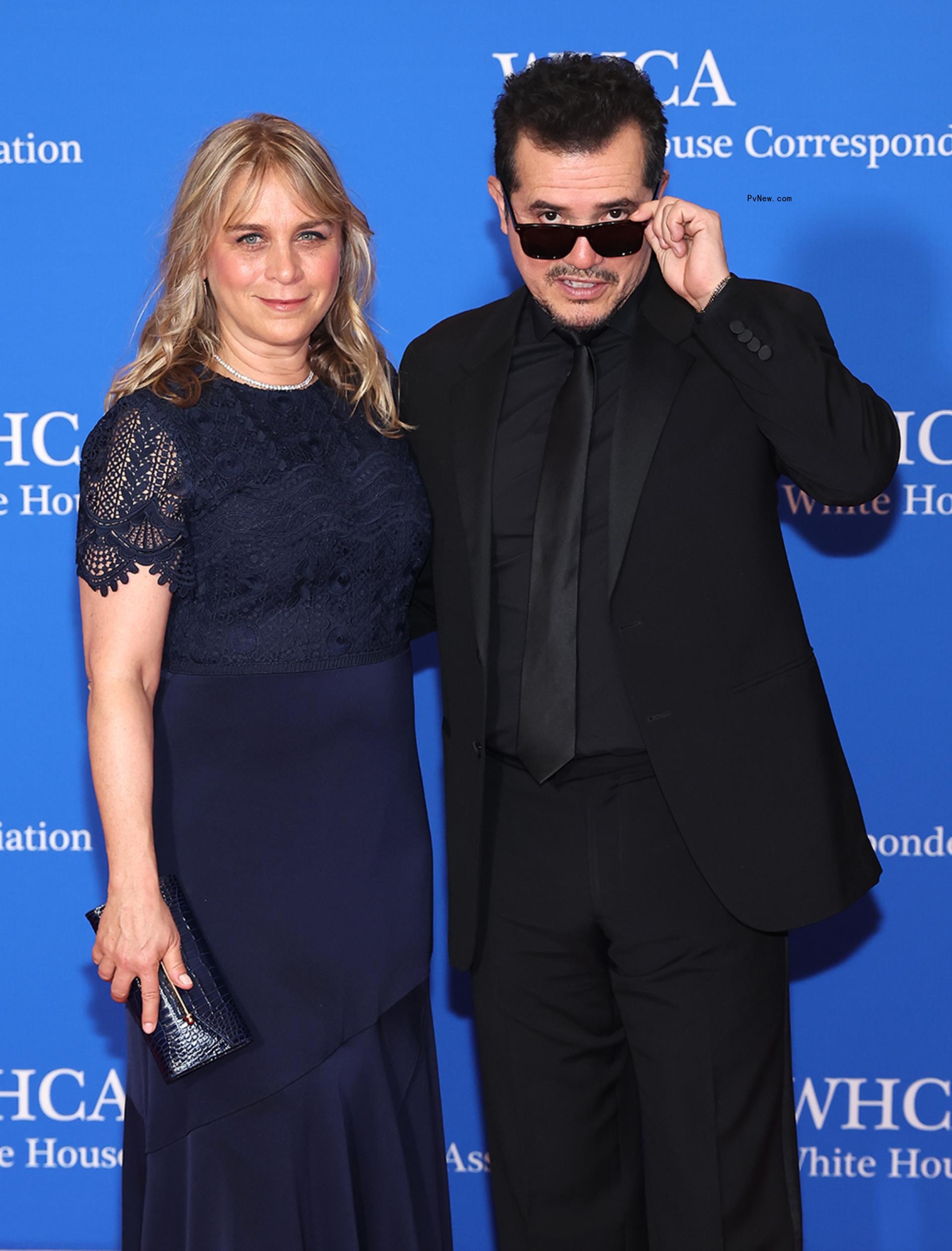 John Leguizamo and his wife.