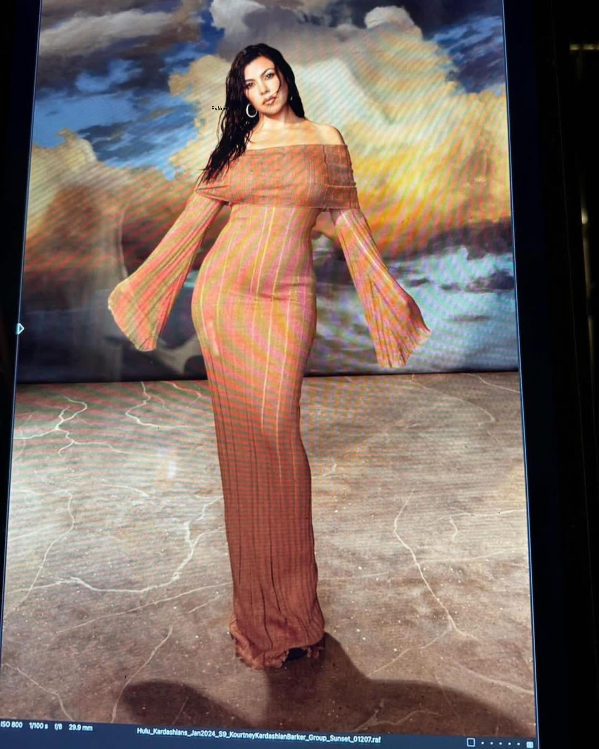 Kourtney Kardashian in a striped dress.