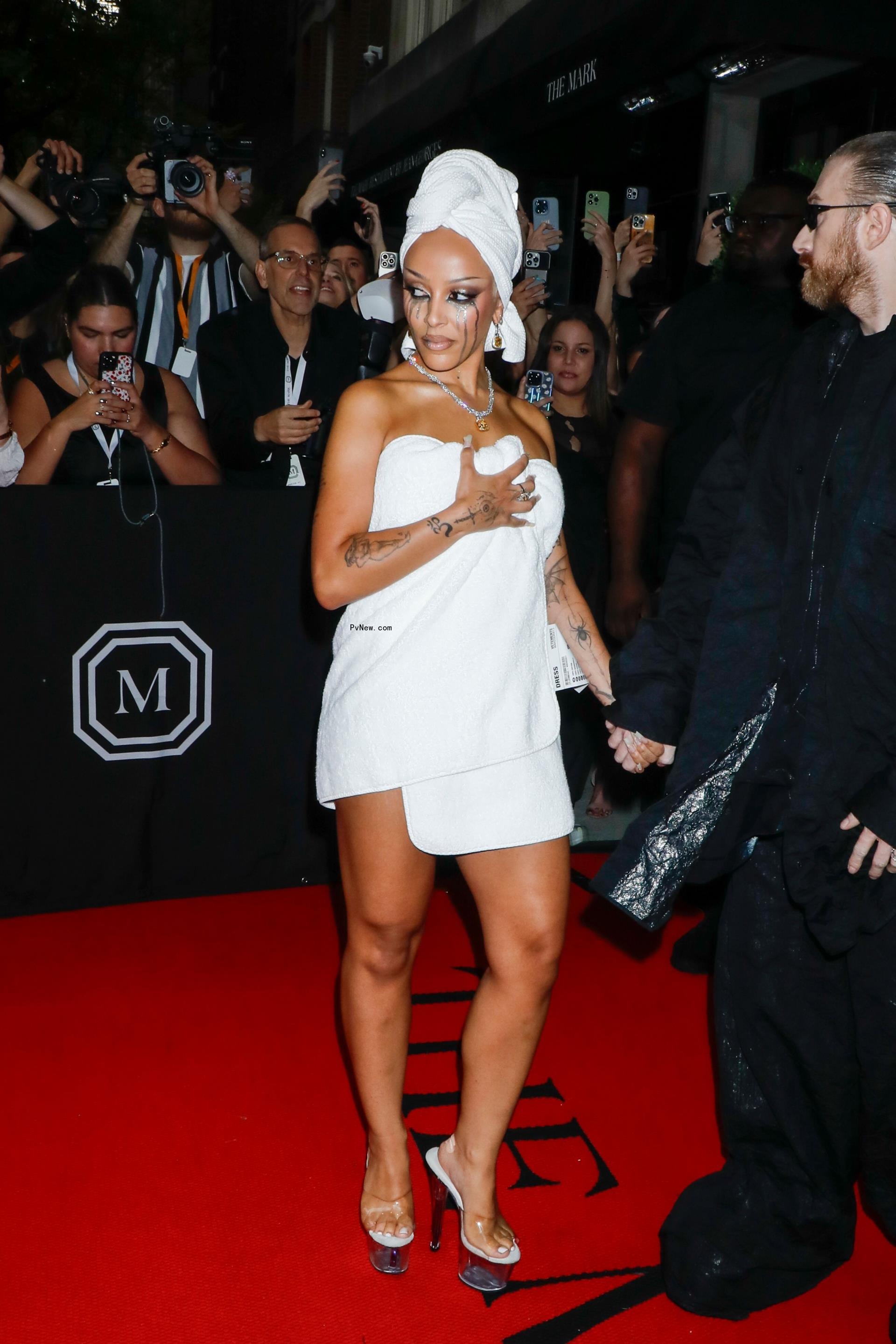 Doja Cat wrapped in a towel