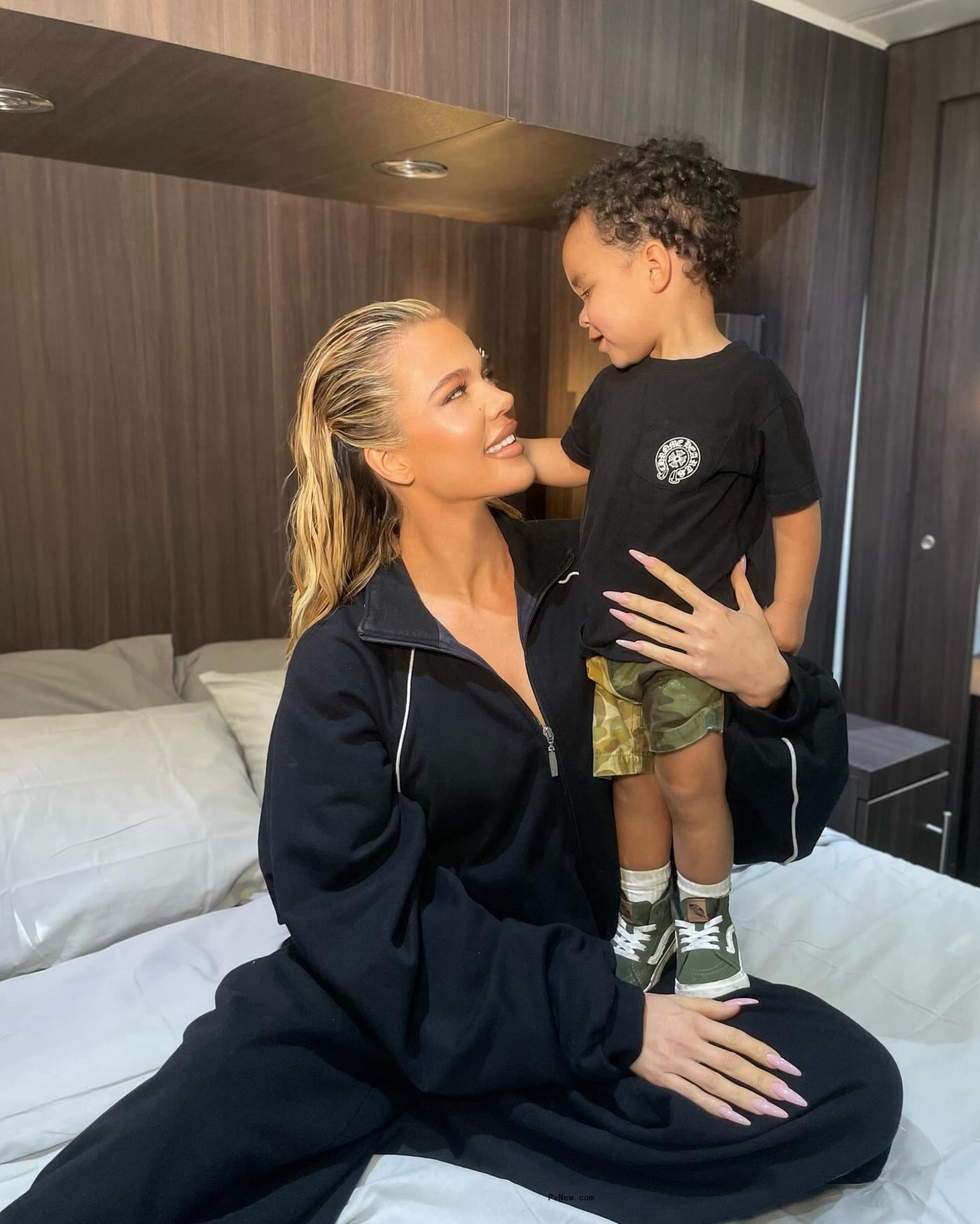 Khloe Kardashian holding Tatum