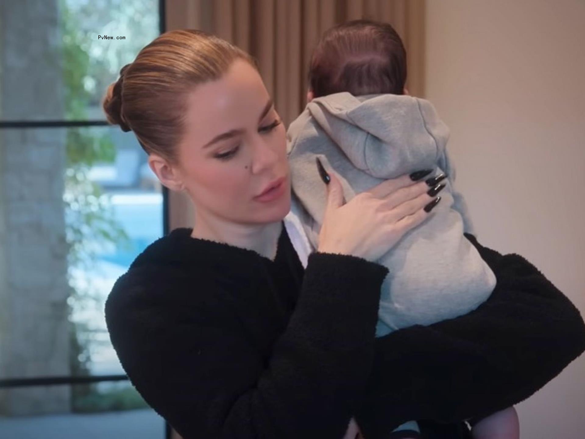 Khloe Kardashian holding son Tatum