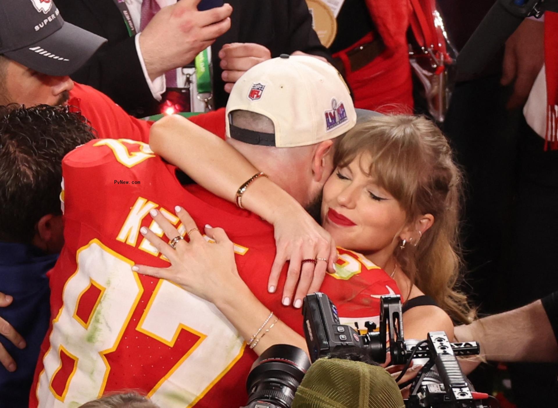 Taylor Swift with Travis Kelce hugging.
