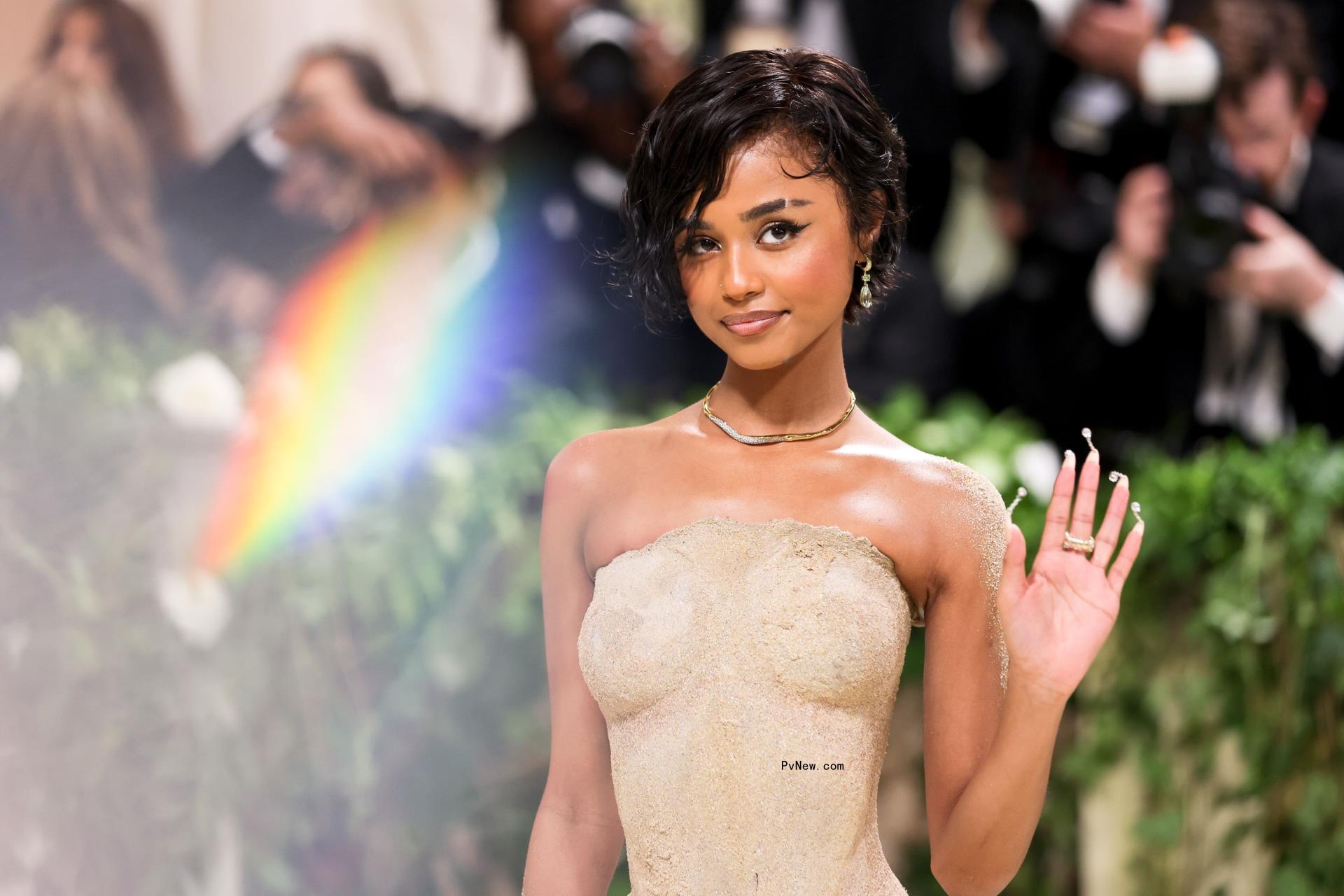 Tyla in a sand dress.