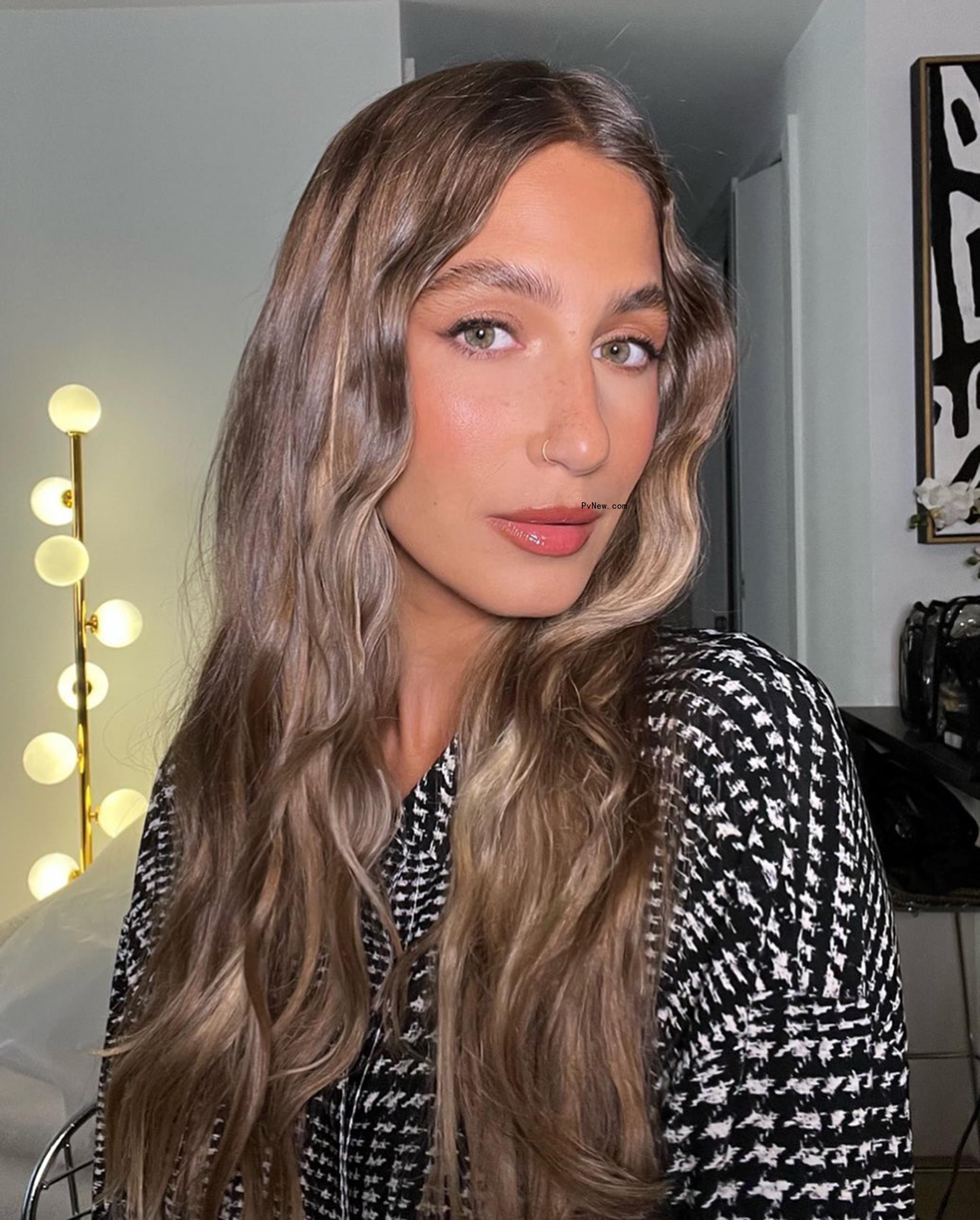 A photo of Amanda Batula posing for a selfie