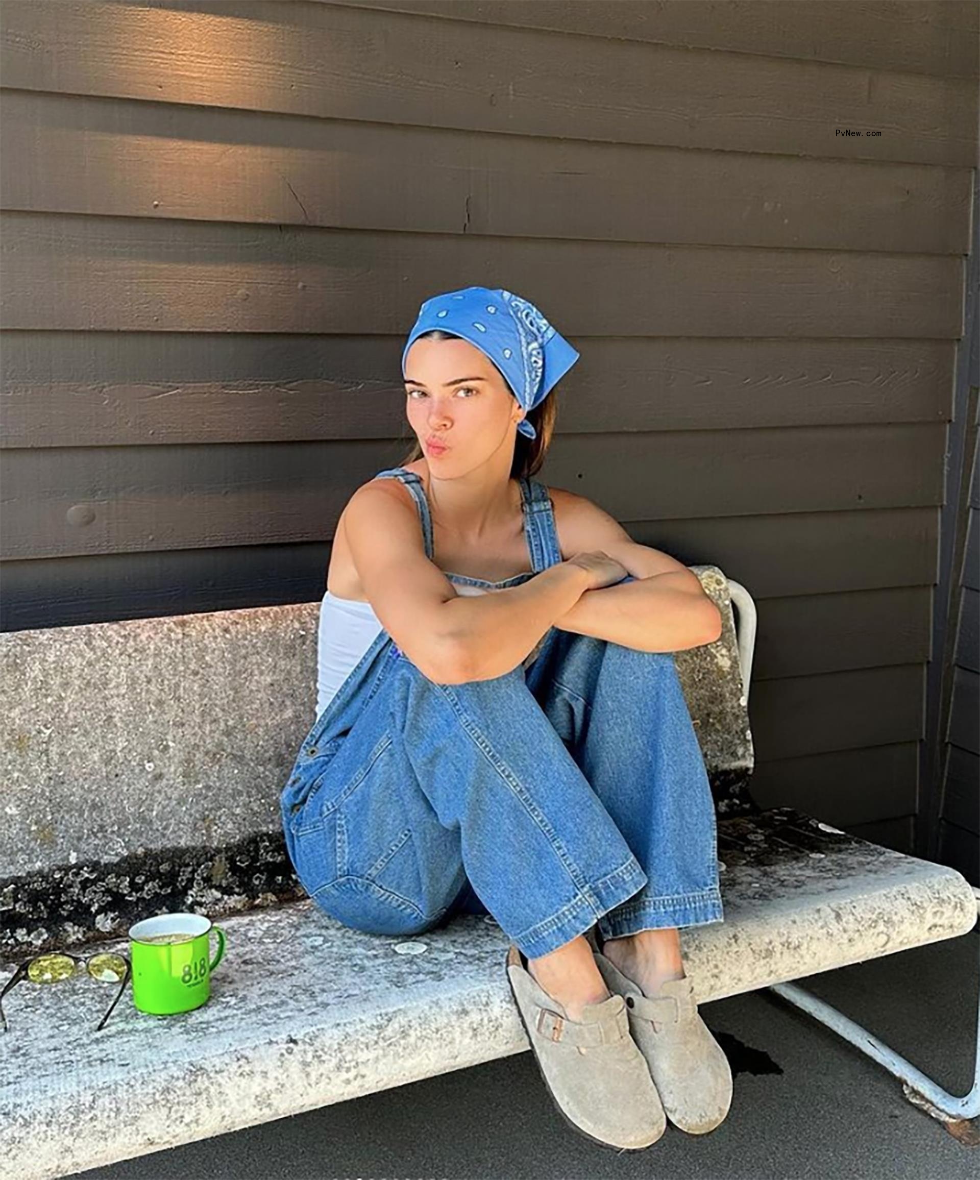 Kendall Jenner on a bench.