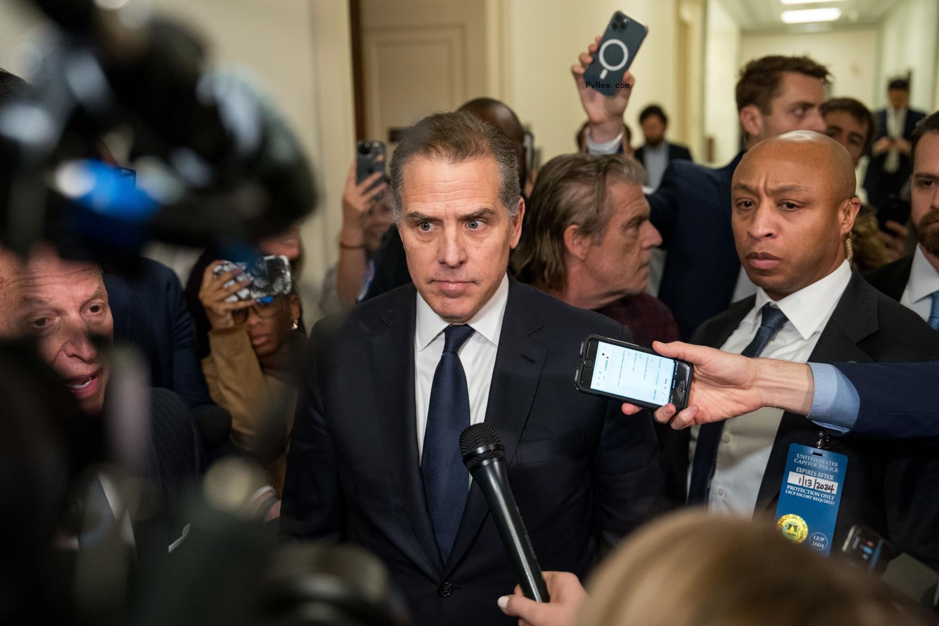 Press trying to speak to Hunter Biden with micropho<i></i>nes in his face.