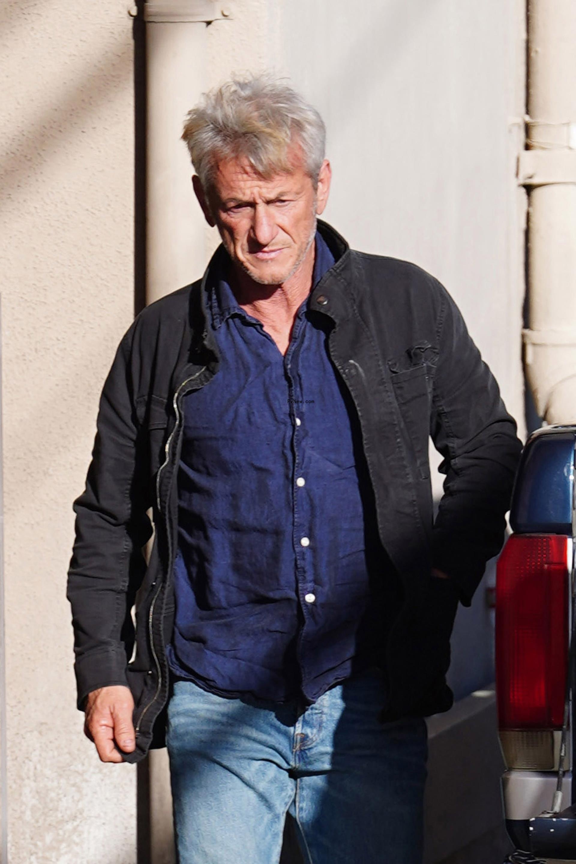 Sean Penn walking.