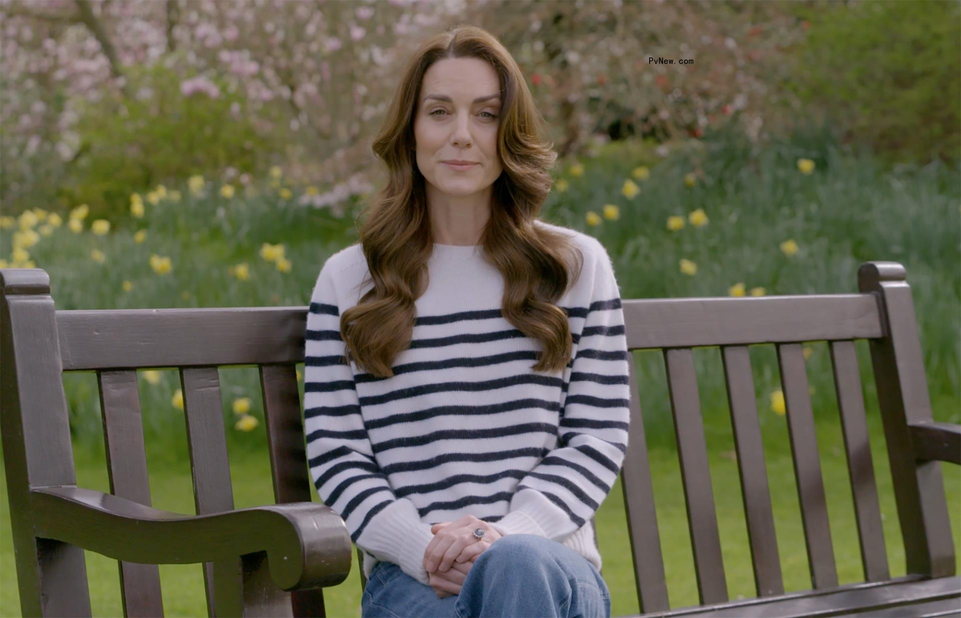 Kate Middleton sitting on a bench.