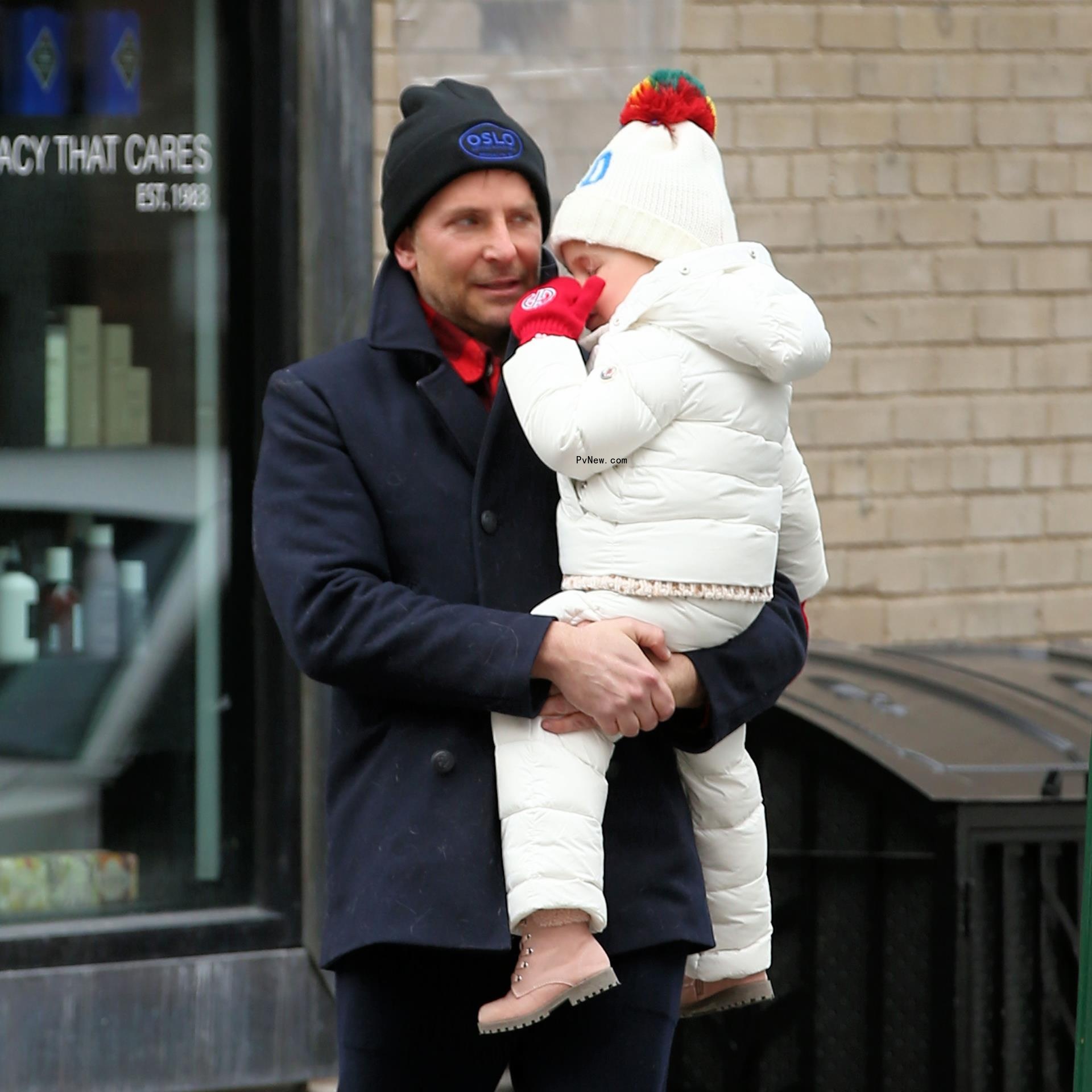 Bradley Cooper holds daughter Lea.