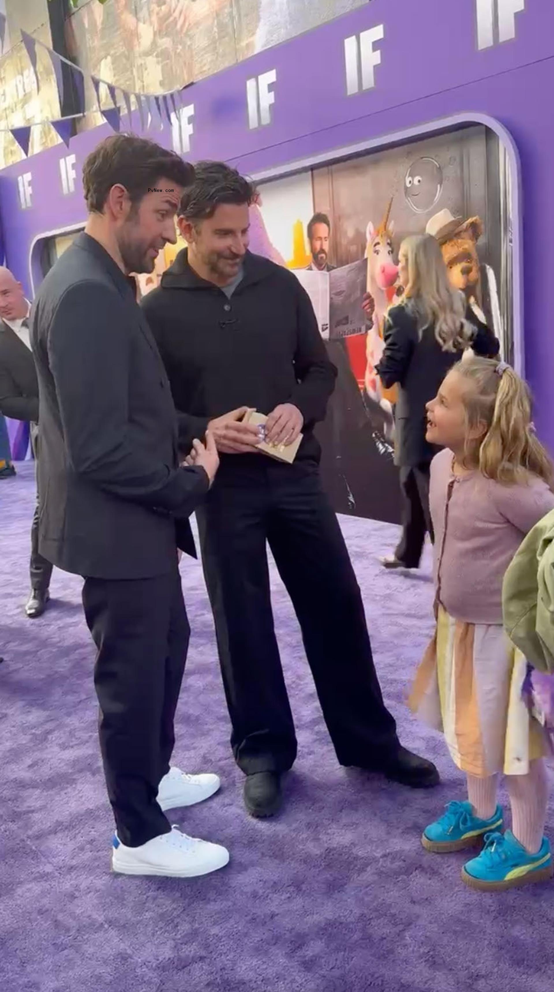 John Krasinski talking to Bradley Cooper's daughter, Lea, at the 