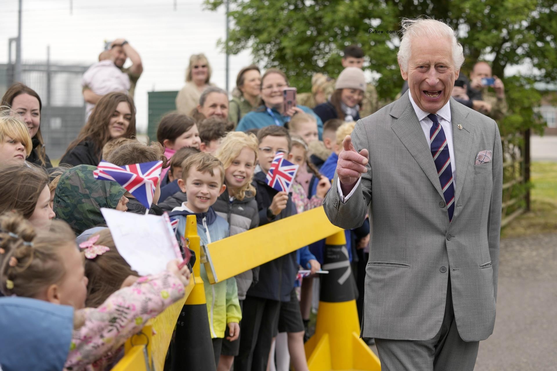 King Charles III walking outside
