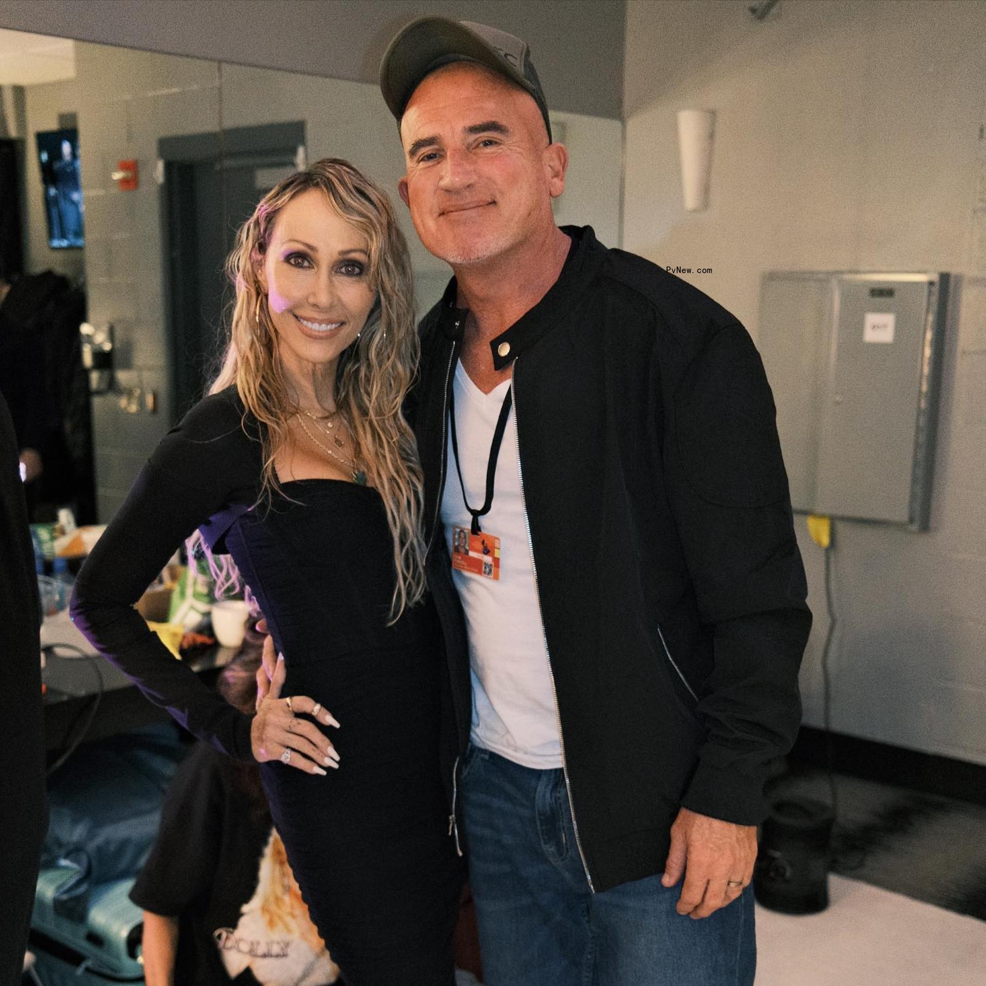 Tish Cyrus and Dominic Purcell posing together