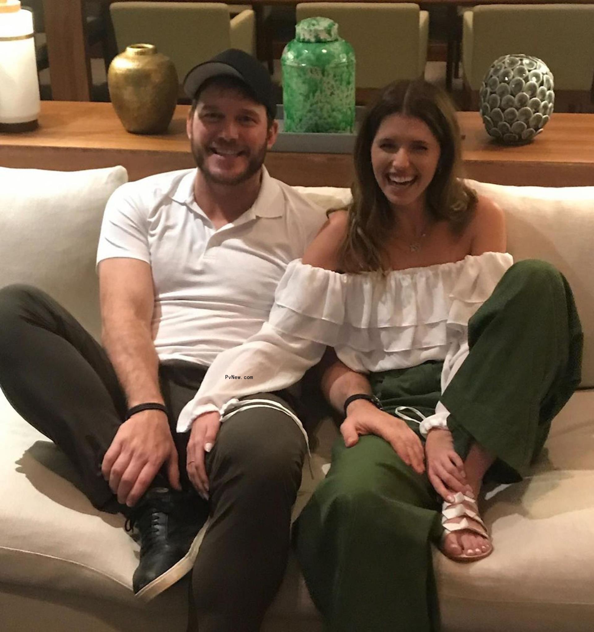 Katherine Schwarzenegger and Chris Pratt on a couch. 