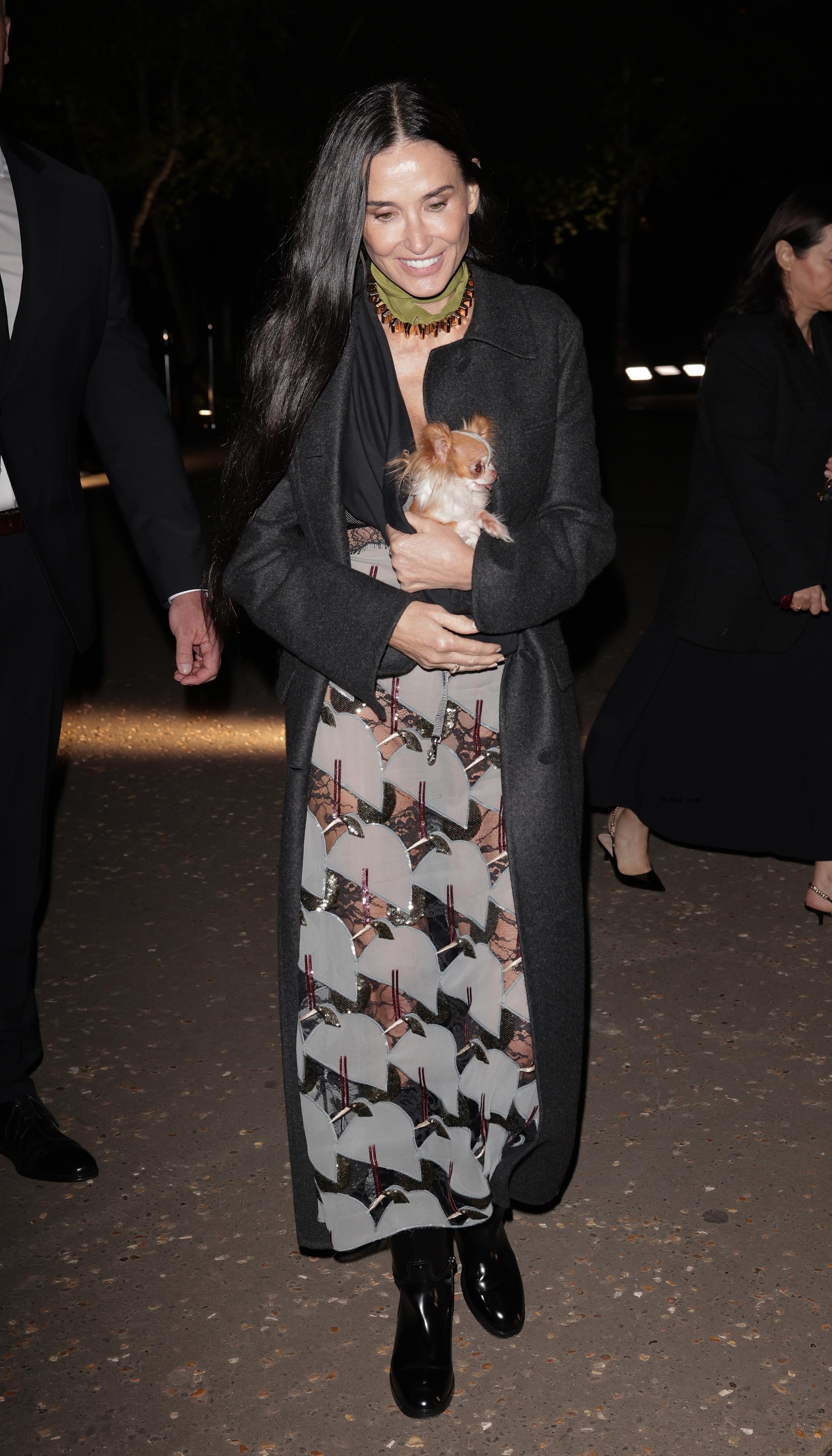 Demi Moore and her dog Pilaf at the Gucci Cruise Show 2025