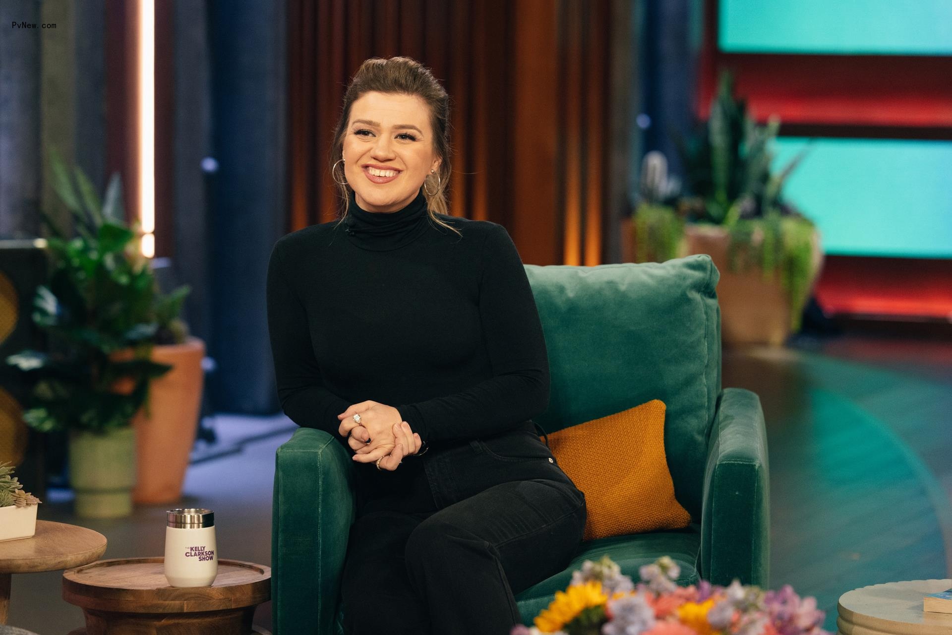 Kelly Clarkson sitting