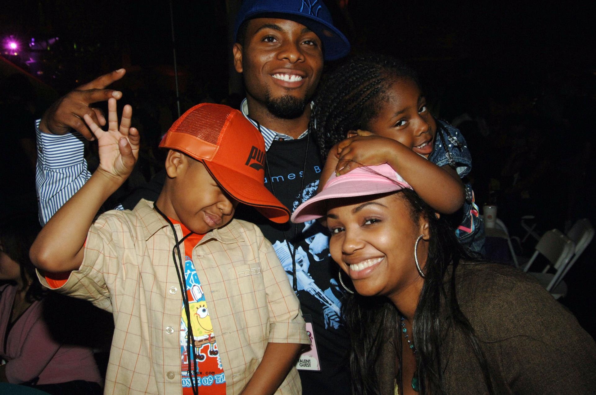 Kel Mitchell, Tyisha Hampton and their daughter at a premiere in 2000.