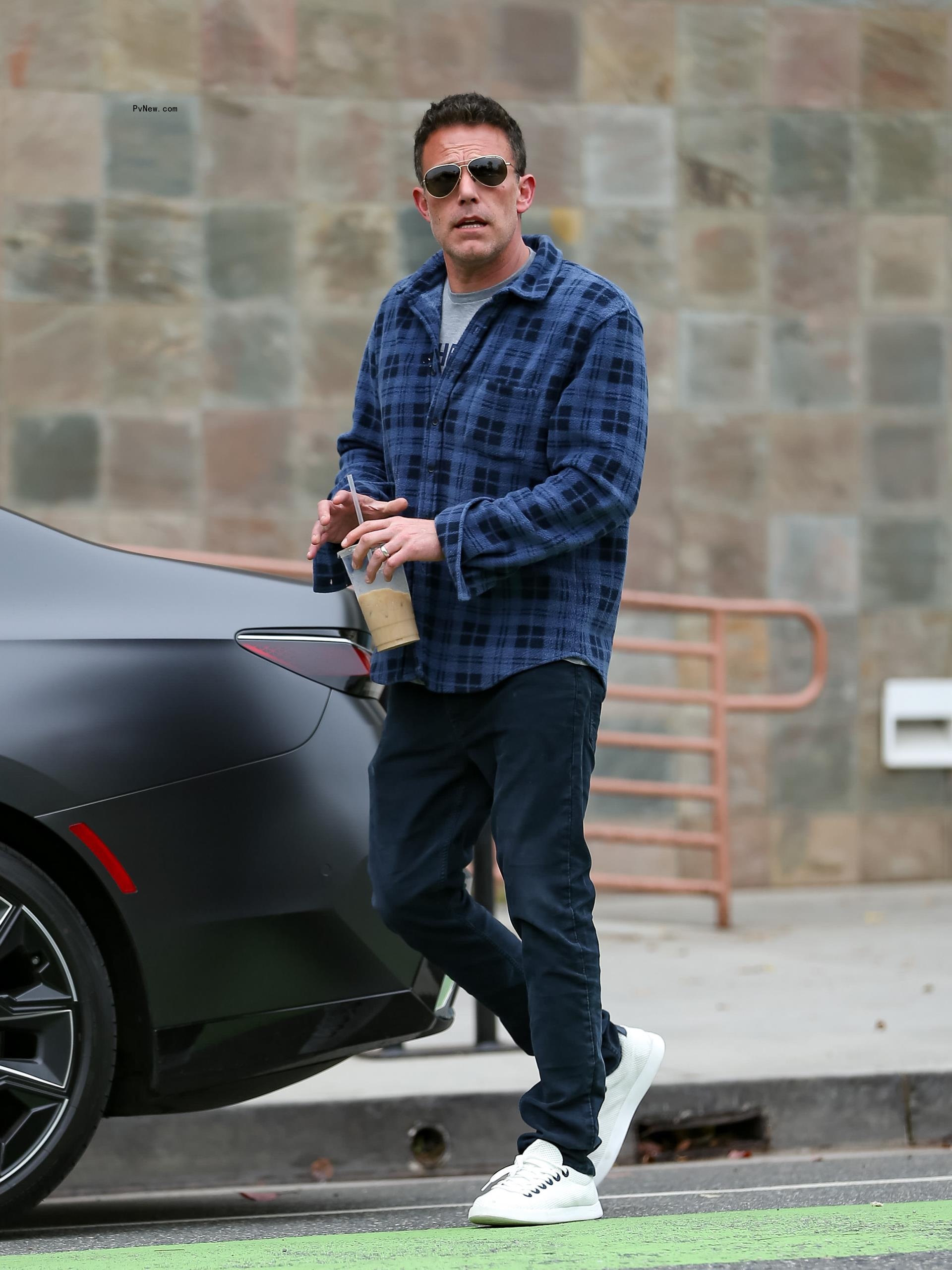 Ben Affleck driving in his car.