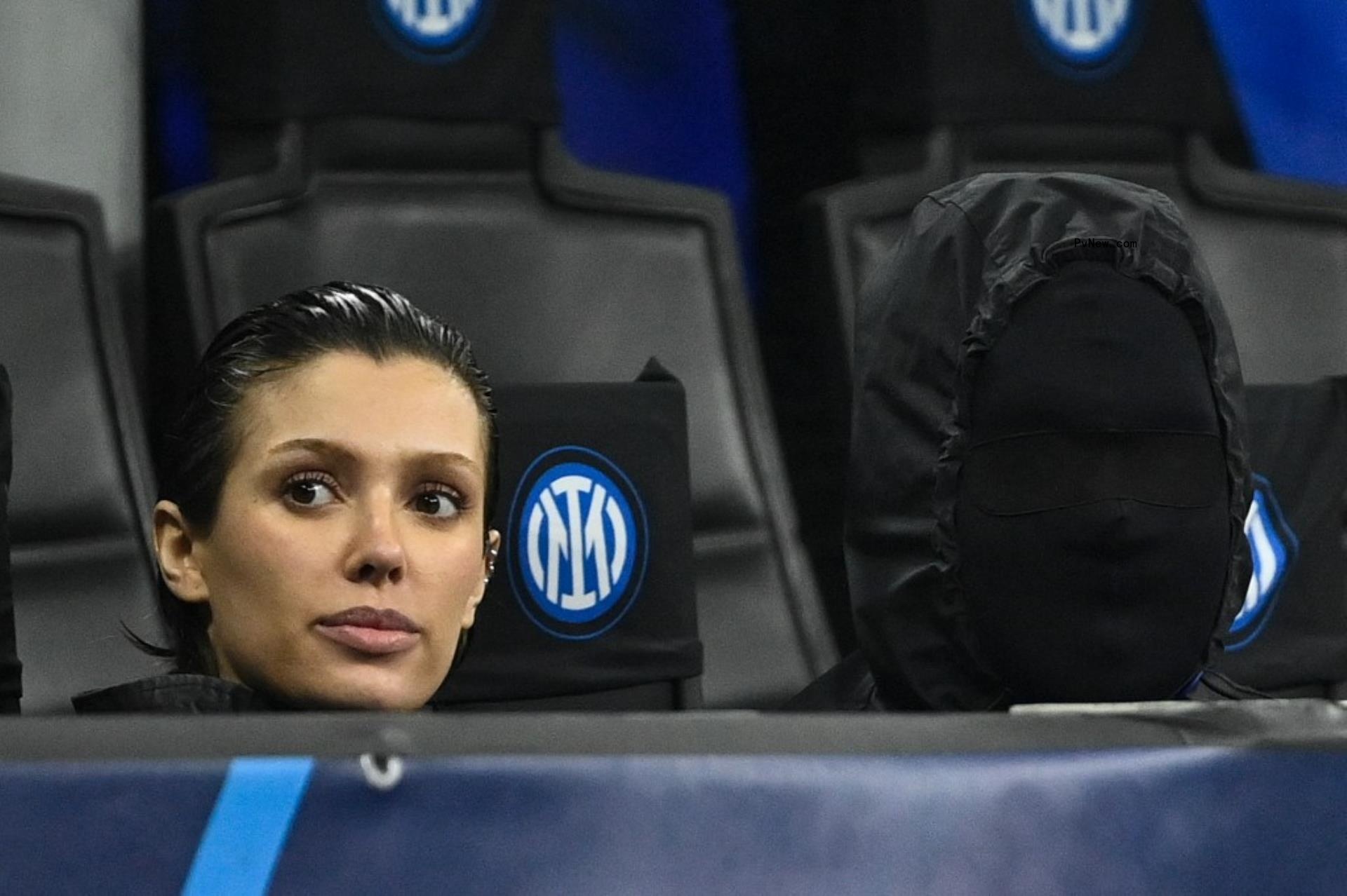 Kanye West wearing a face mask with Bianca Censori at a soccer game