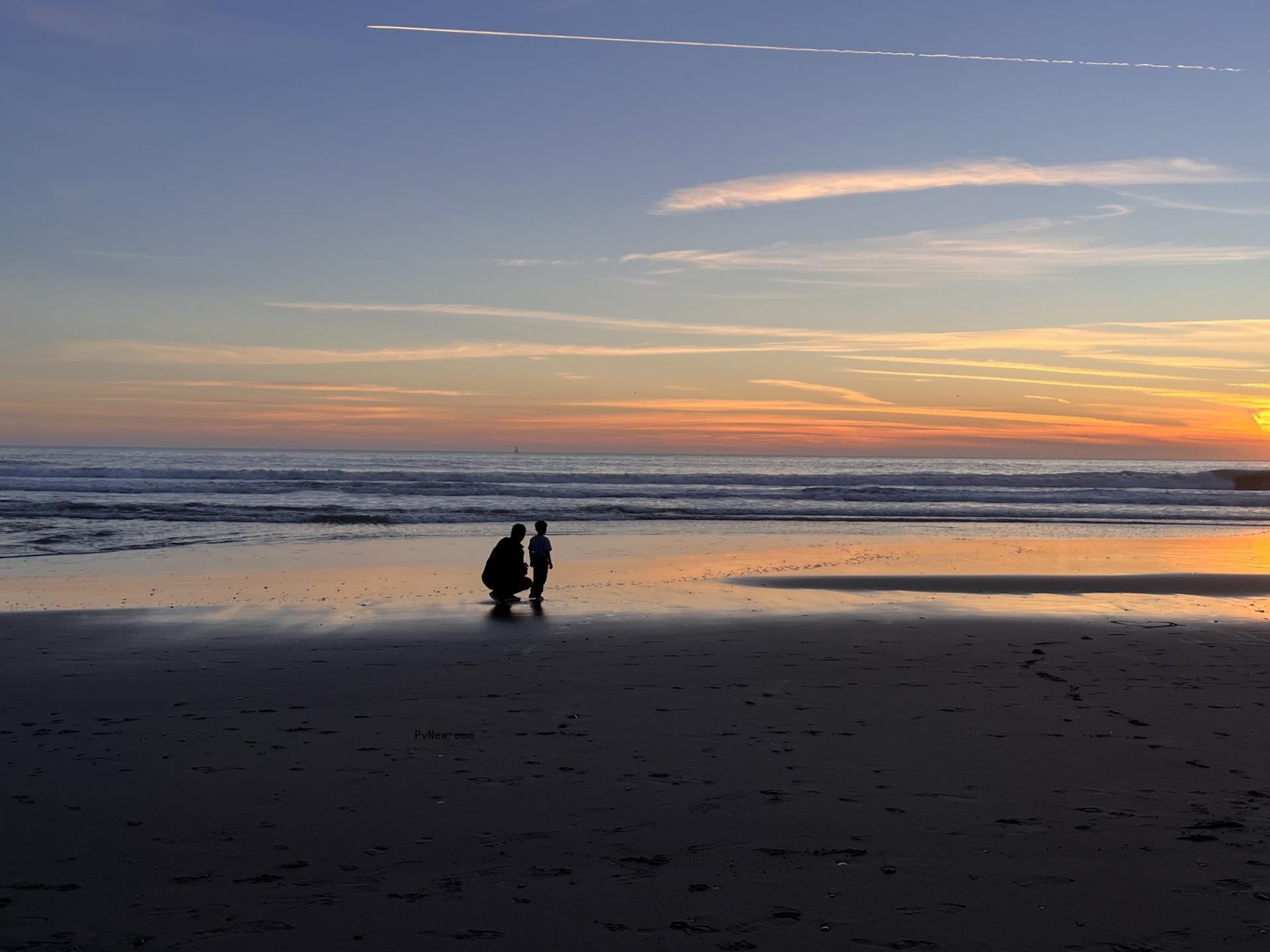 Bridgit Mendler at the beach with her son.