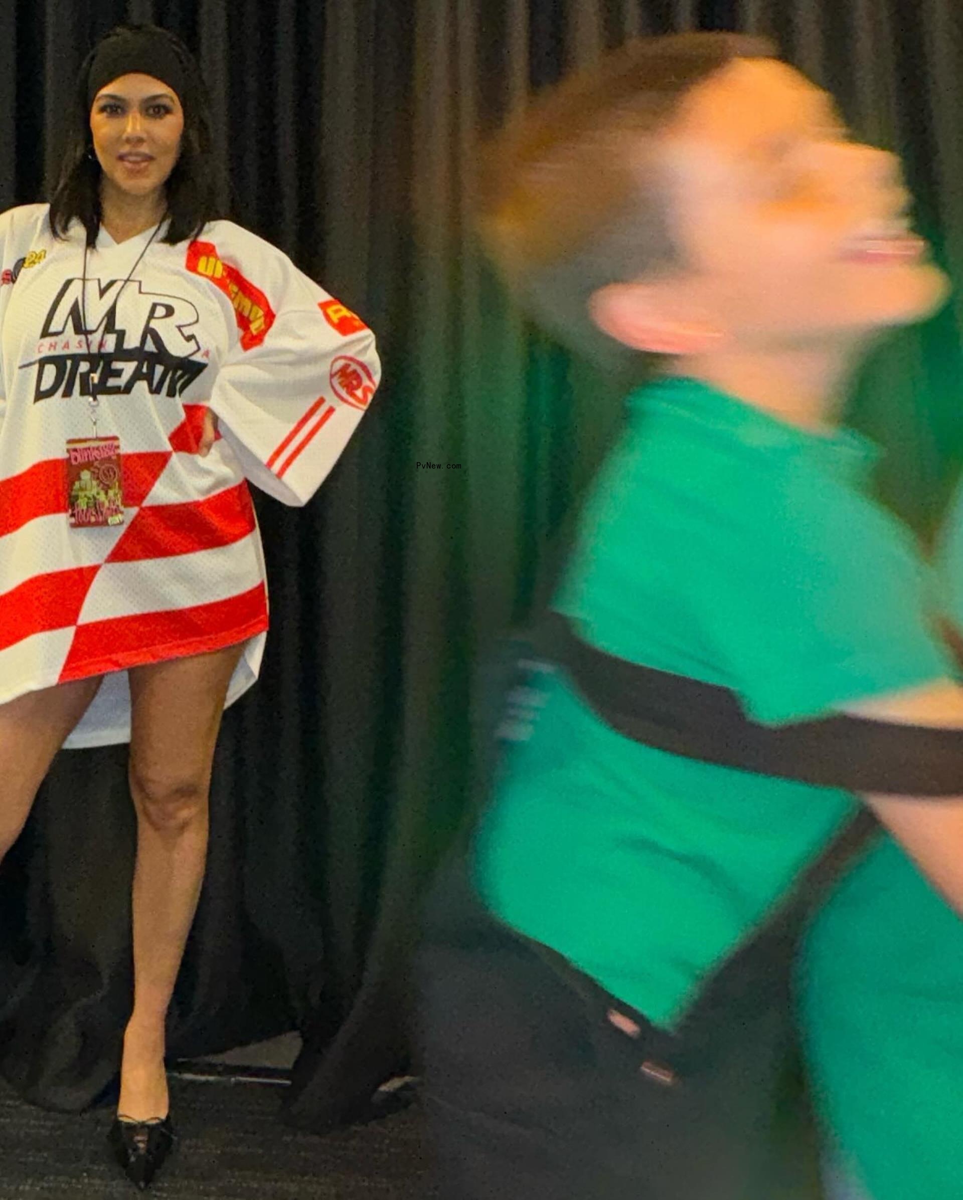 Kourtney Kardashian posing in a jersey with no pants