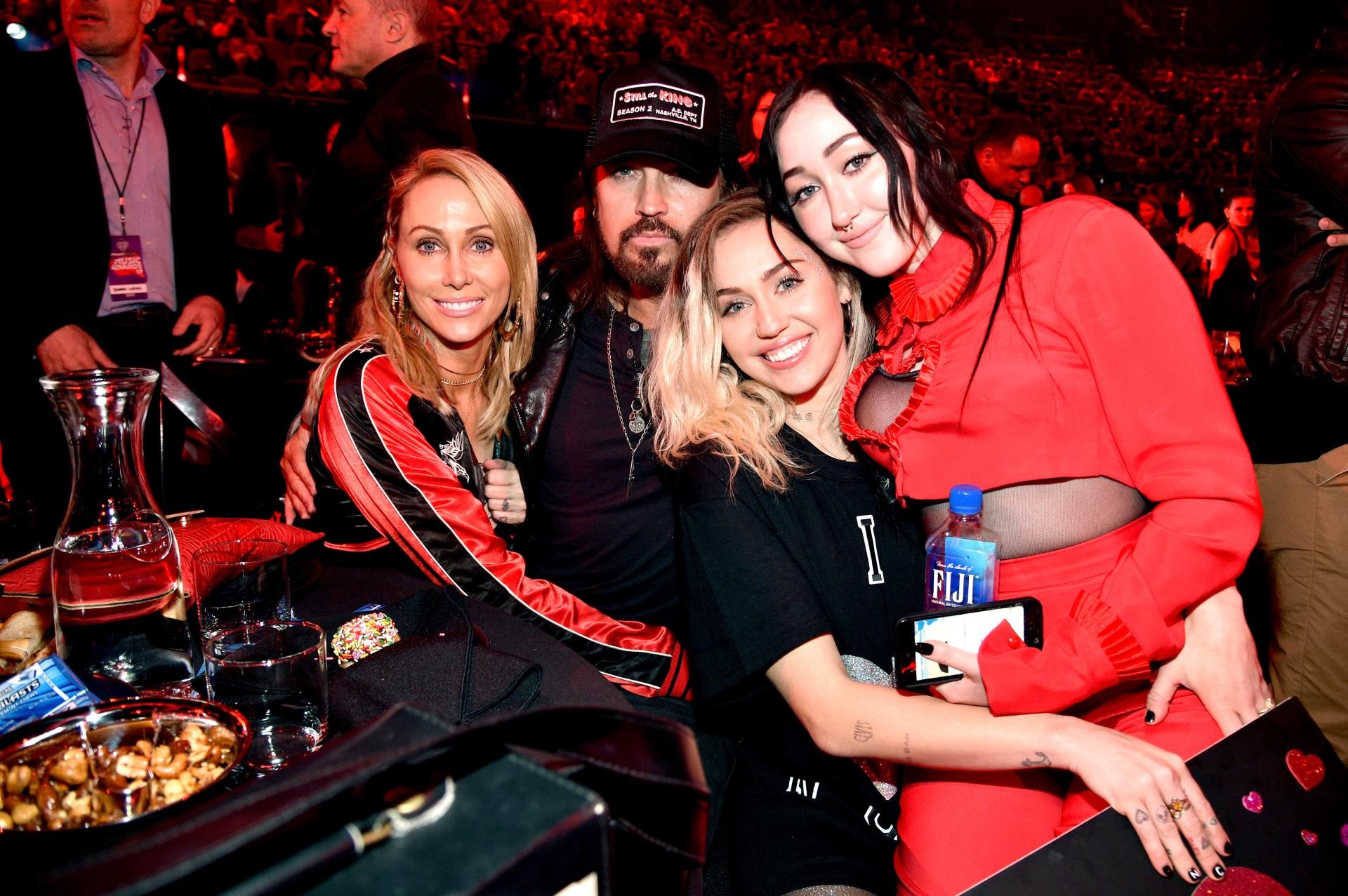 Tish, Billy Ray, Miley and Noah Cyrus, hugging