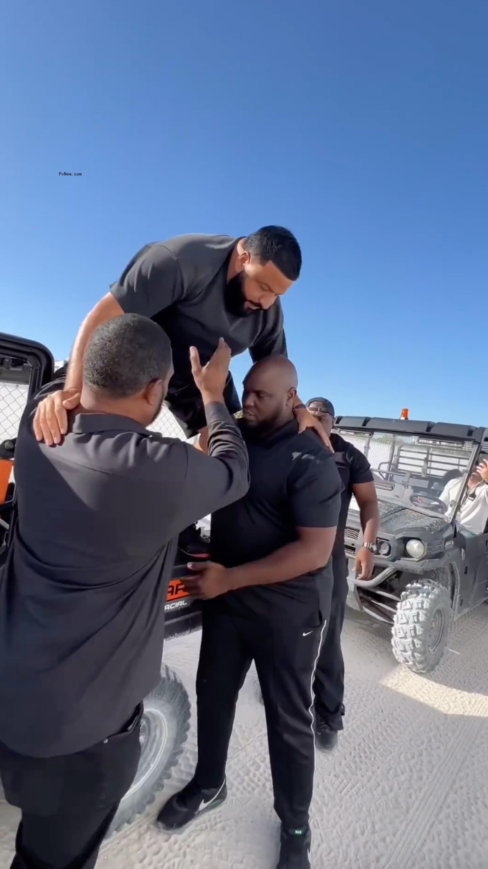 Dj Khaled being carried.