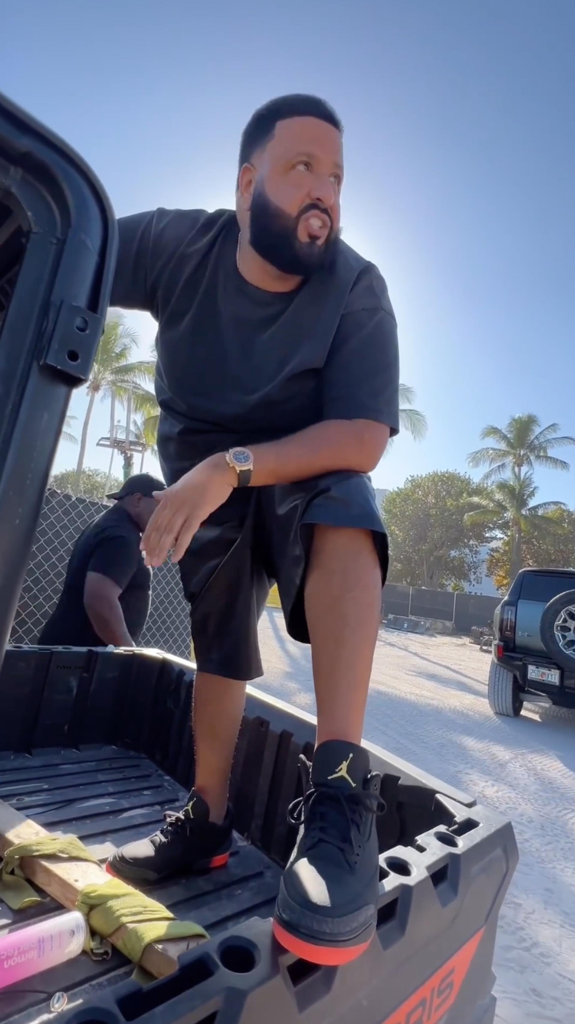 Dj Khaled in the back of a truck.