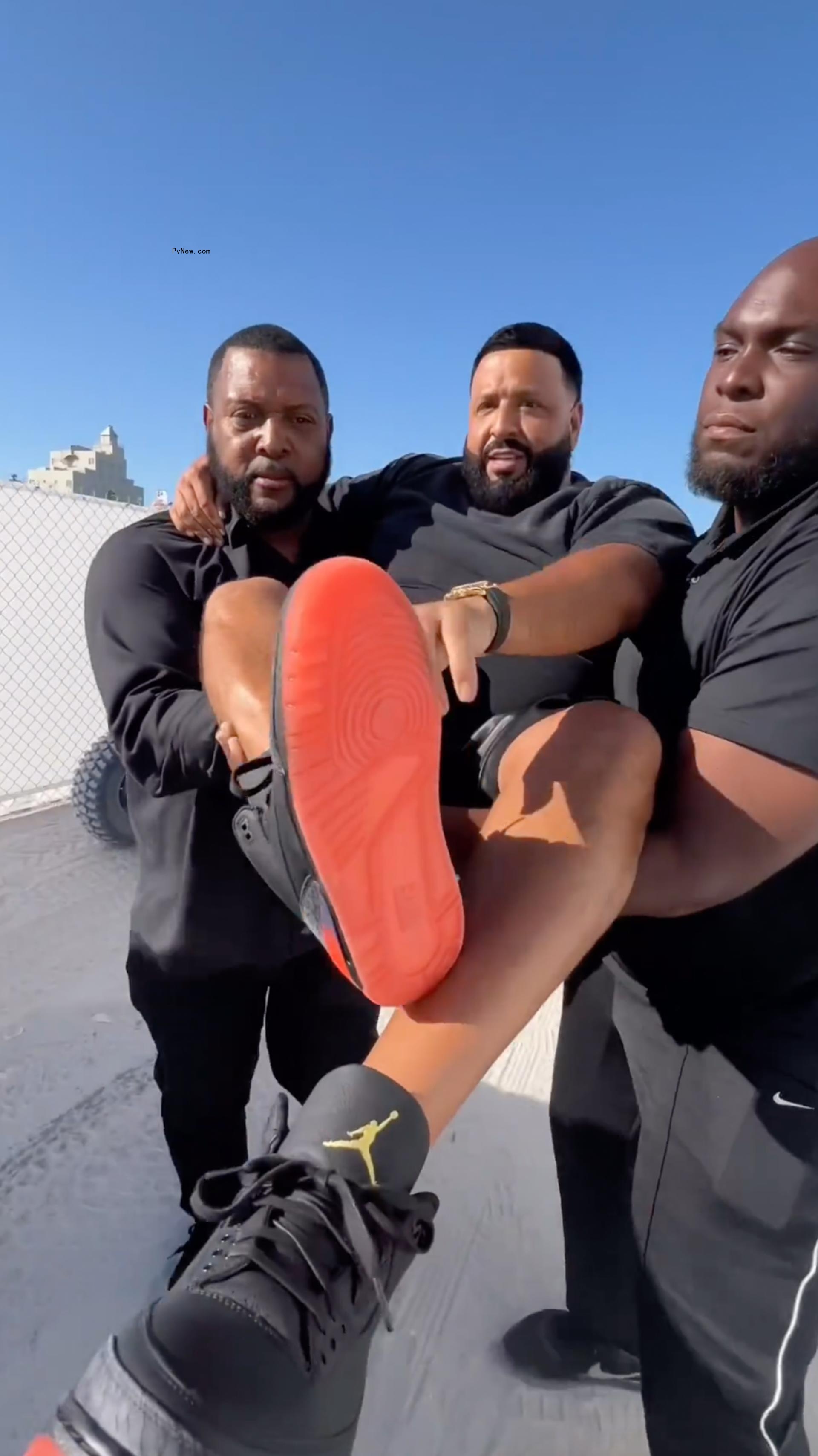 DJ Khaled being carried.
